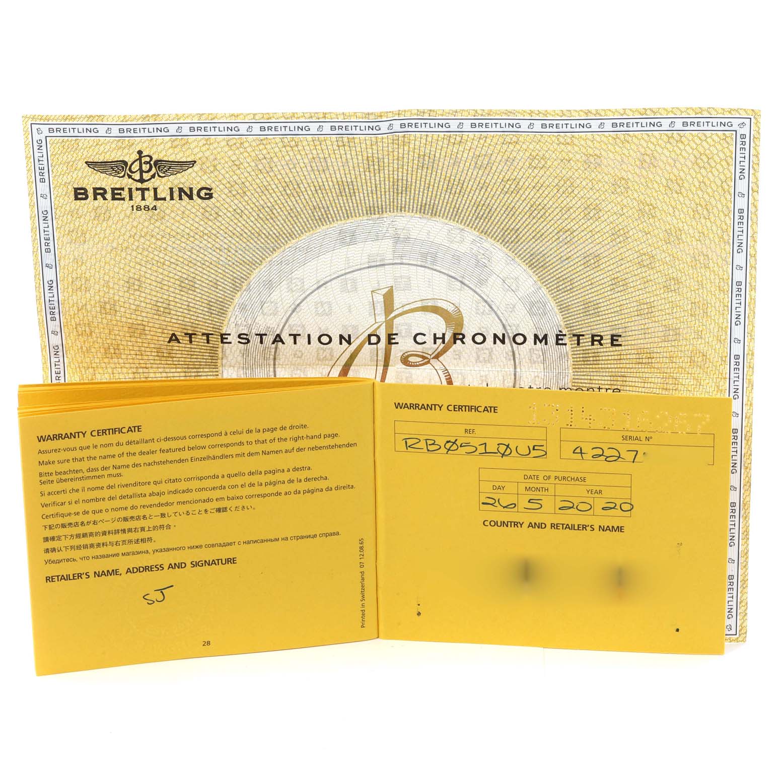 This image shows the warranty certificate and chronometer attestation for the Breitling Transocean RB0510 Men's Rose Gold Black Dial RB0510 Men's Rose Gold Black Dial model watch.