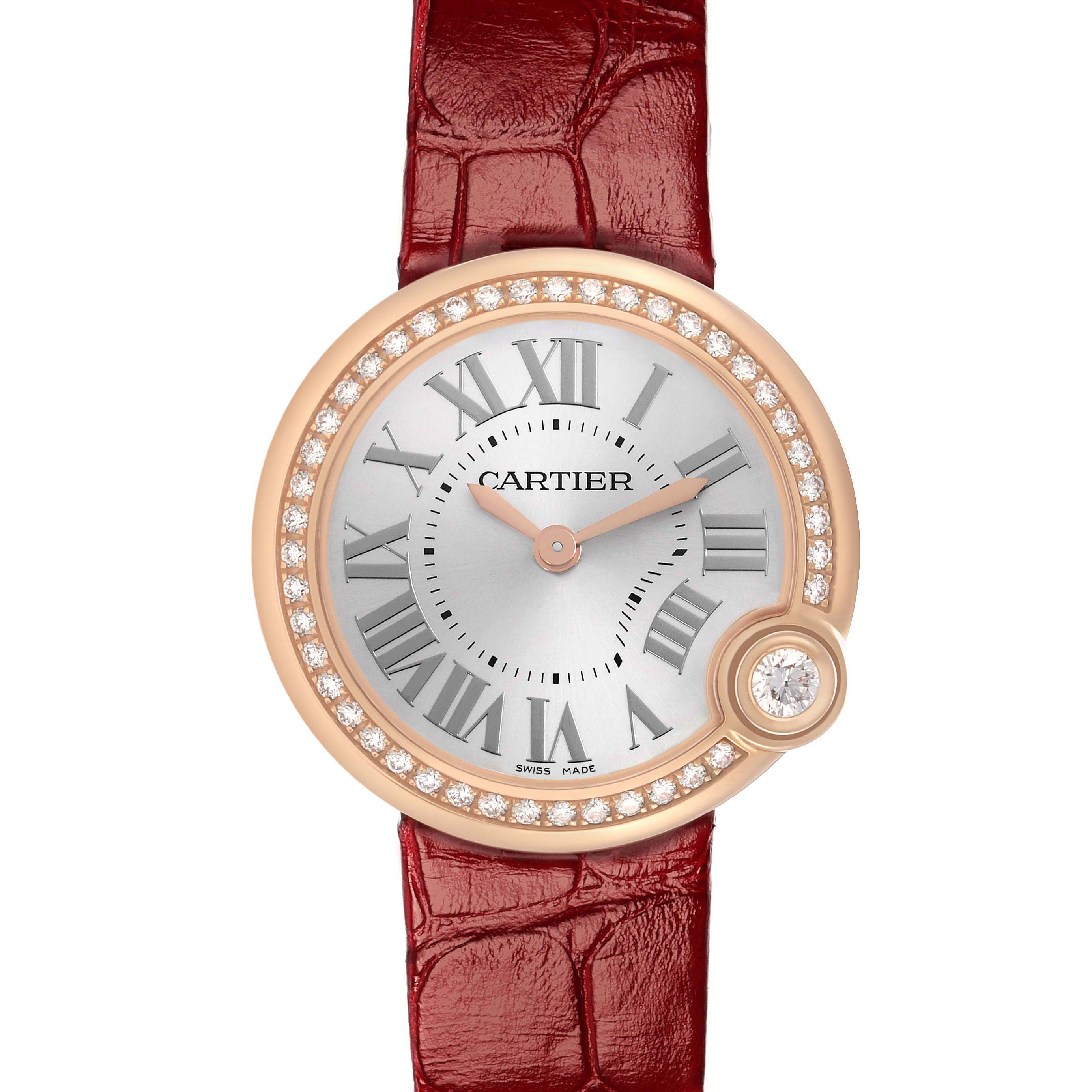 The Cartier Ballon Blanc WJBL0005 Women's Rose Gold Silver Dial watch is shown from a top-down angle, highlighting its circular face, diamond bezel, and red leather strap.