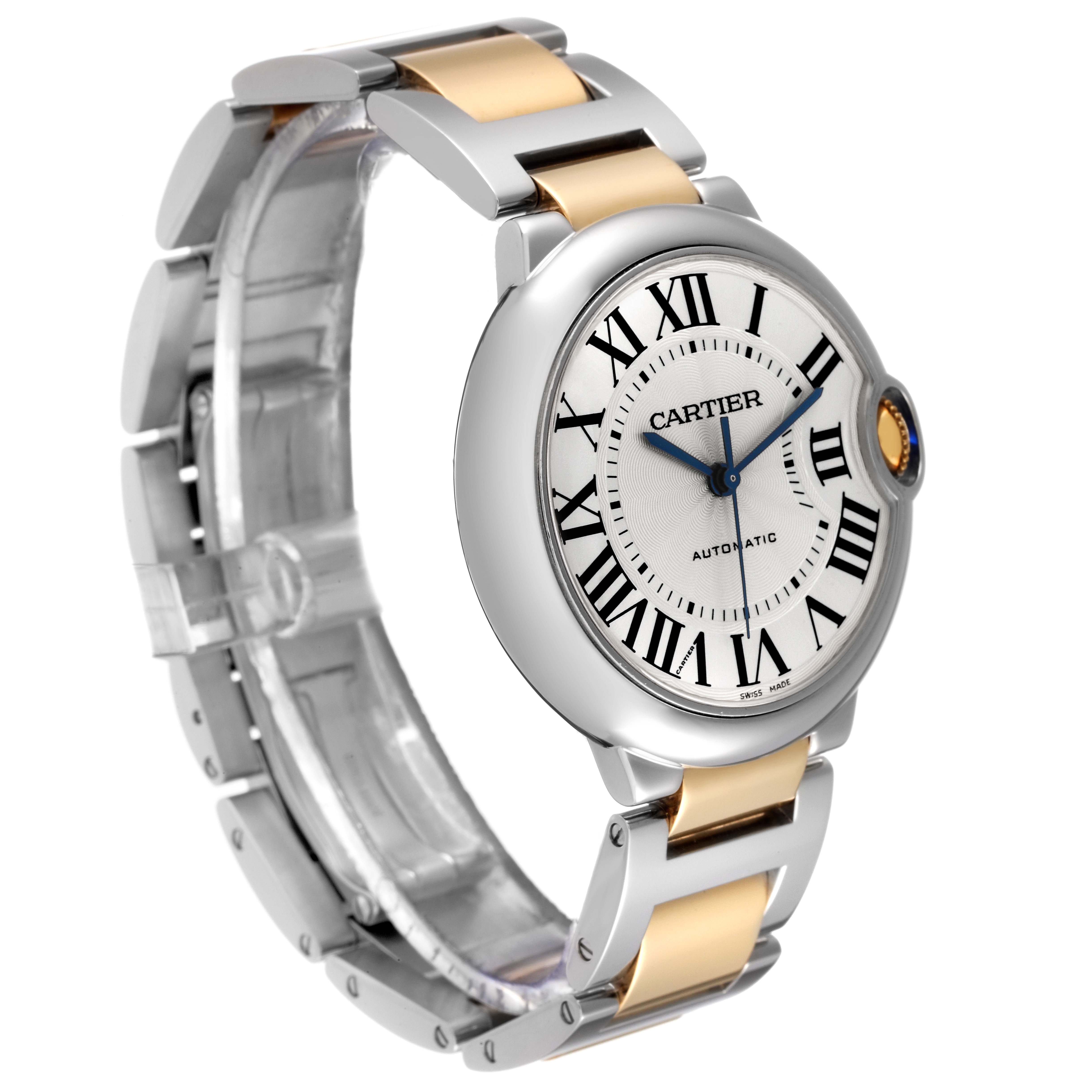 This image shows a Cartier Ballon Bleu W2BB0012 Men
s Steel and Gold (two tone) Silver Dial W2BB0012 Men
s Steel and Gold (two tone) Silver Dial watch from a front angle, highlighting its dial, Roman numerals, and two-tone bracelet.