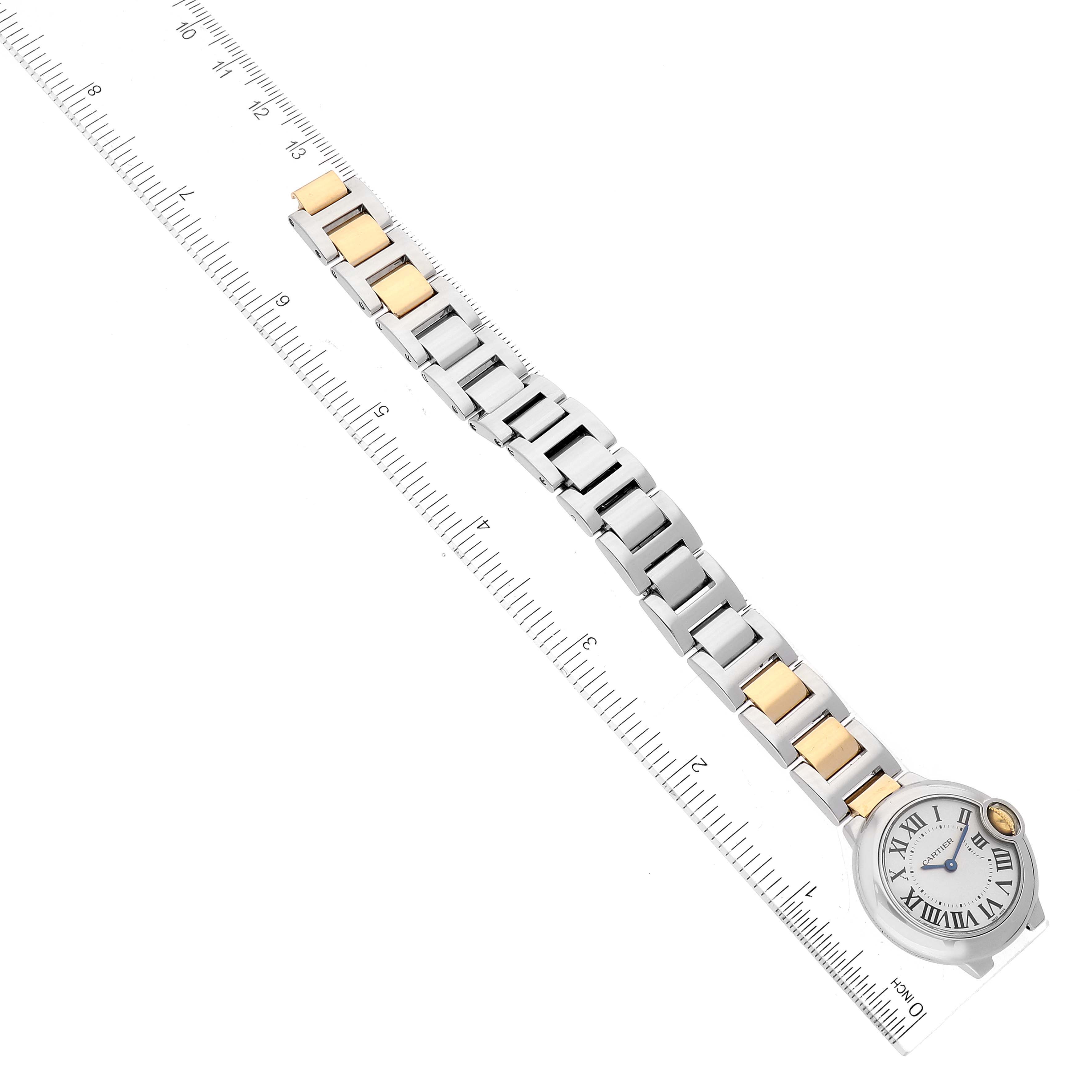 The image shows a Cartier Ballon Bleu W69007Z3 Women
s Steel and Gold (two tone) Silver Dial W69007Z3 Women
s Steel and Gold (two tone) Silver Dial model watch from a top-down angle next to a measuring ruler.