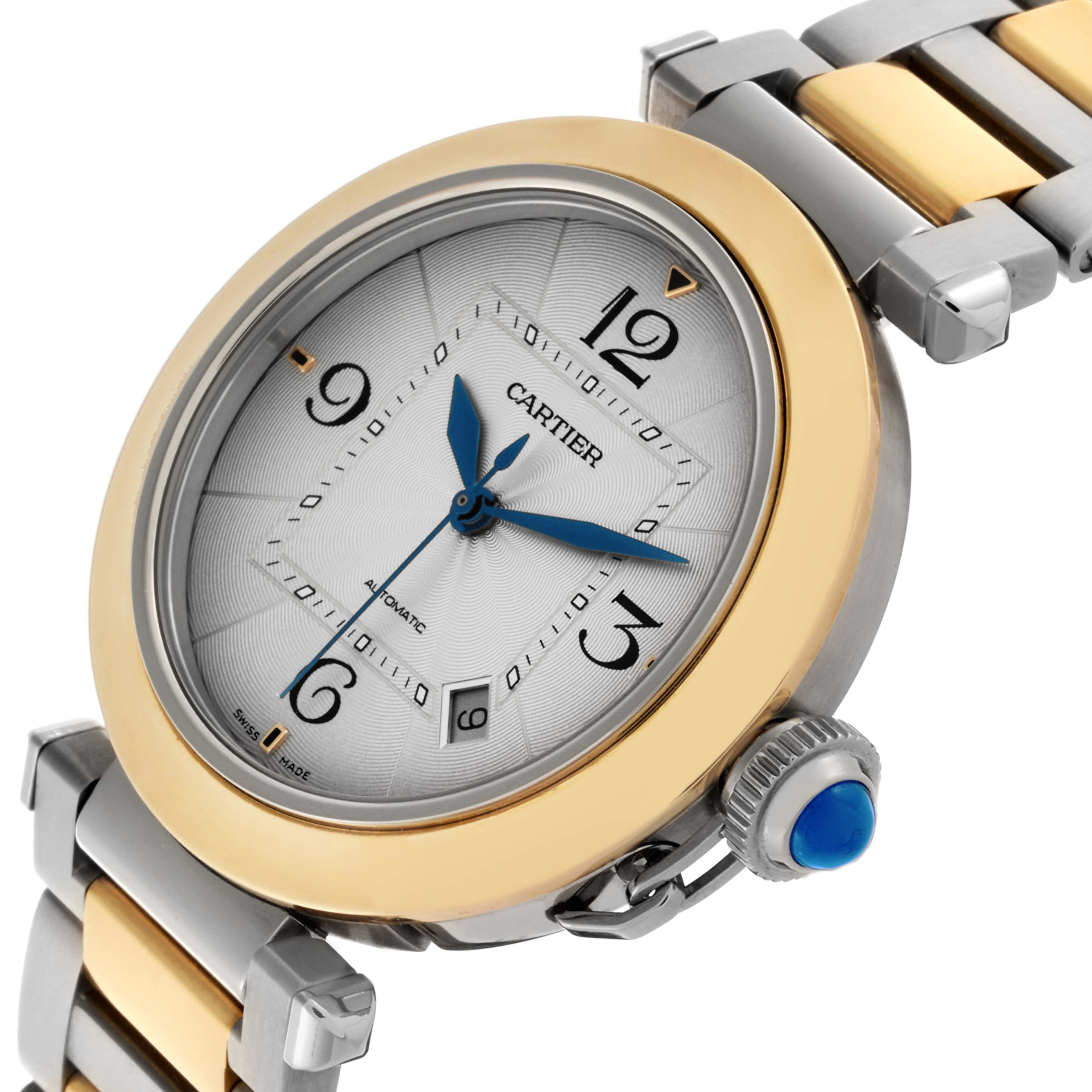 The Cartier Pasha W2PA0009 Men's Steel and Gold (two tone) Silver Dial W2PA0009 Men's Steel and Gold (two tone) Silver Dial watch is shown at an angled view, displaying the dial, bezel, crown, and two-tone bracelet.