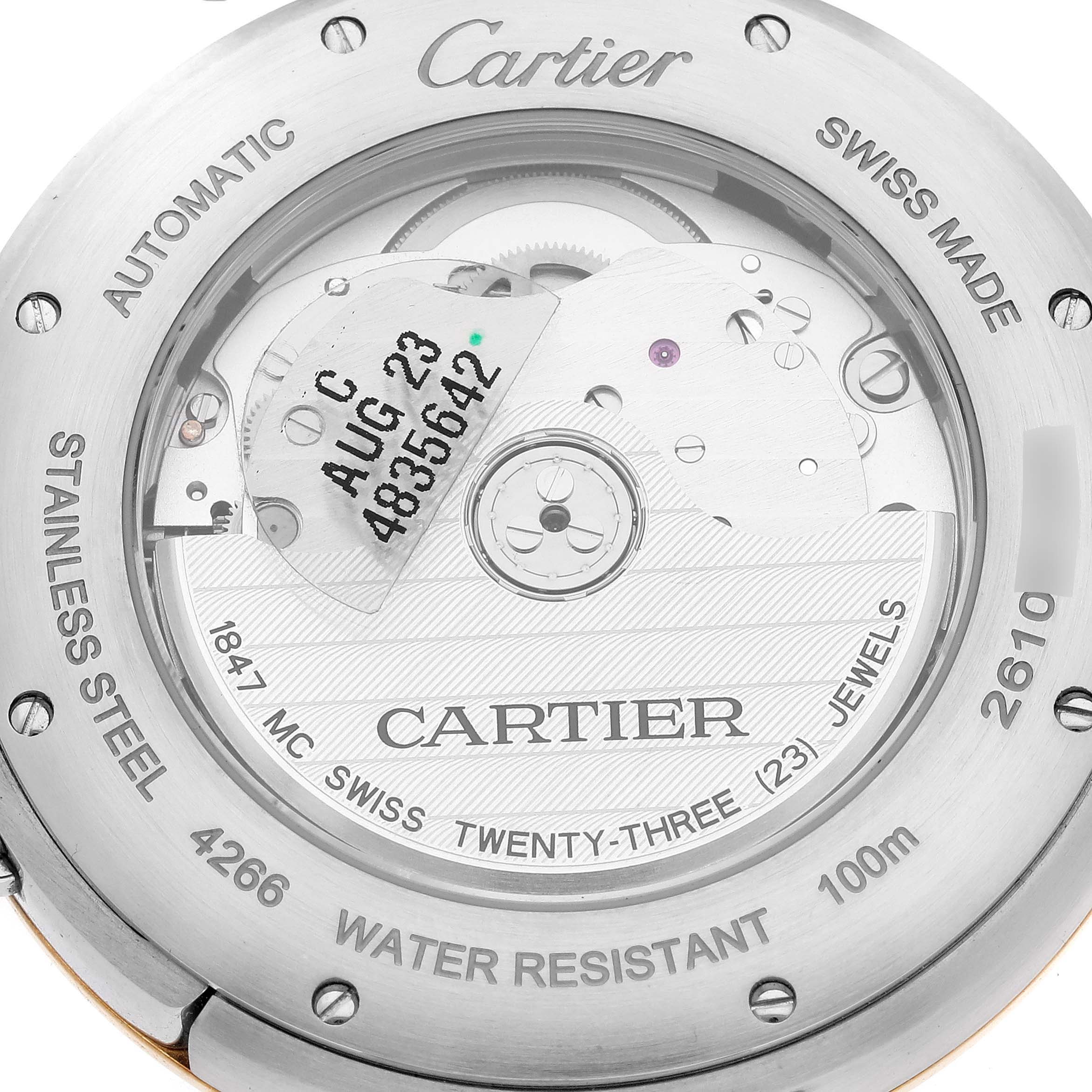 The image shows the back of a Cartier Pasha W2PA0009 Men's Steel and Gold (two tone) Silver Dial W2PA0009 Men's Steel and Gold (two tone) Silver Dial watch, highlighting the movement and engravings.
