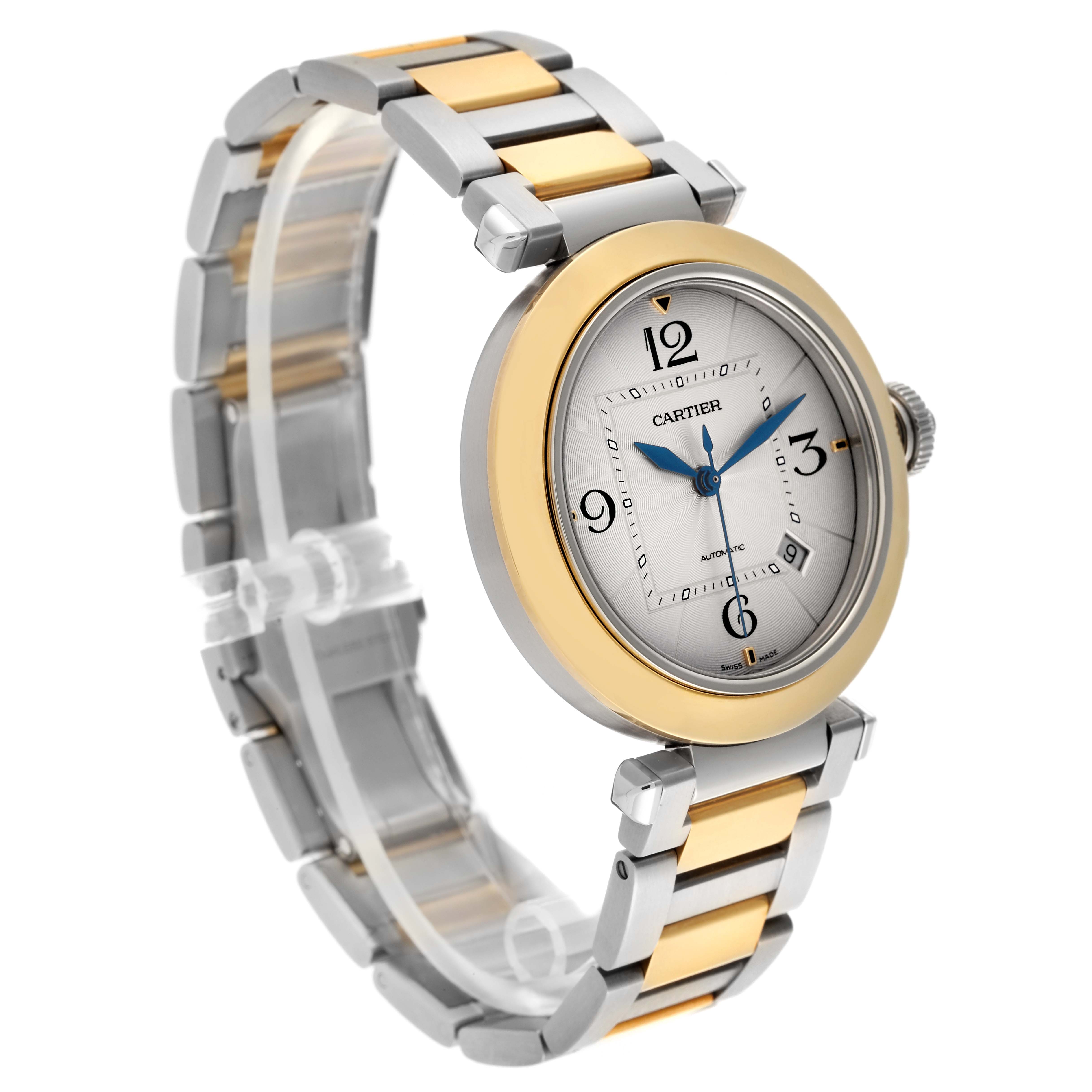 The Cartier Pasha W2PA0009 Men's Steel and Gold (two tone) Silver Dial W2PA0009 Men's Steel and Gold (two tone) Silver Dial watch is shown at an angle highlighting the face, bezel, crown, and two-tone bracelet.