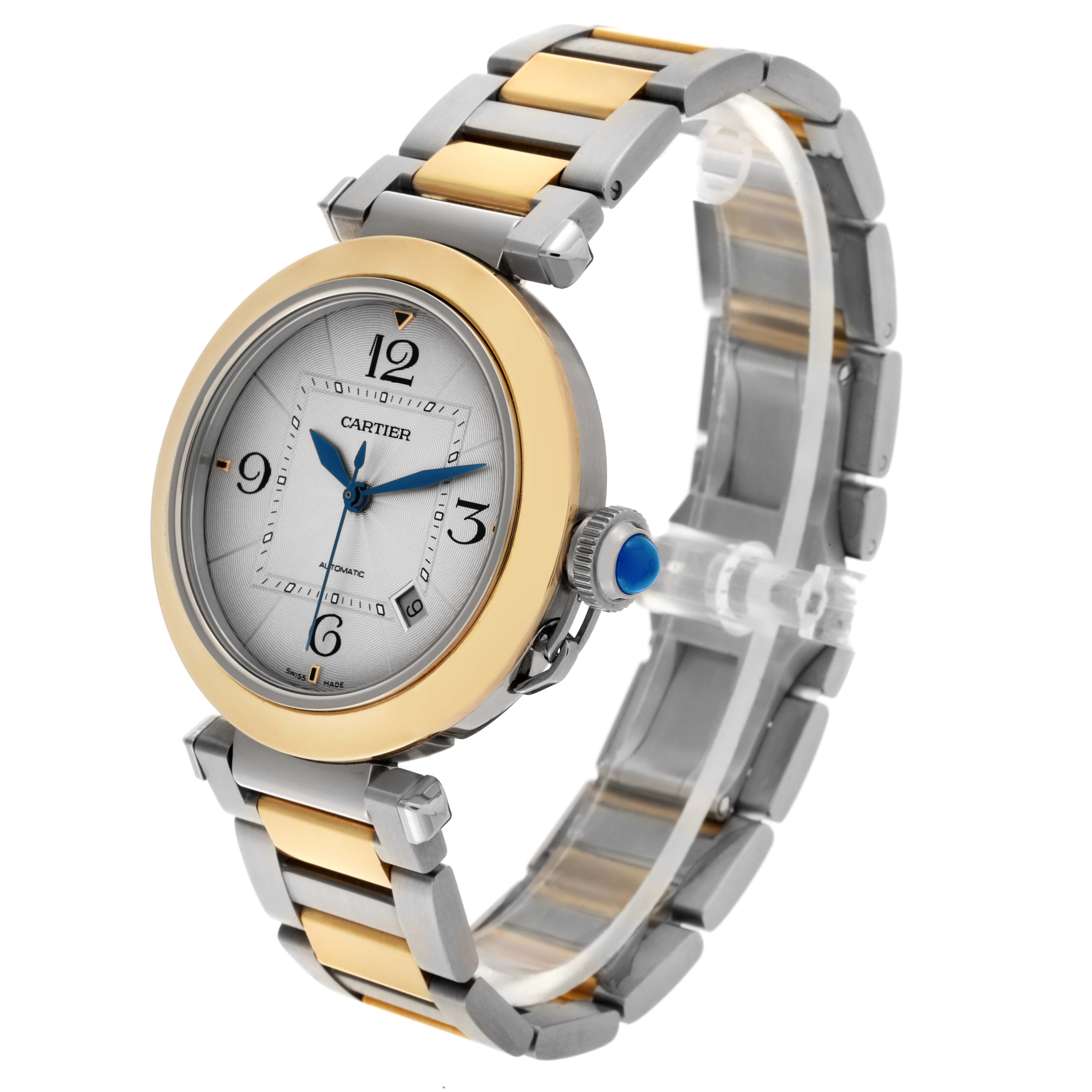 The Cartier Pasha W2PA0009 Men's Steel and Gold (two tone) Silver Dial W2PA0009 Men's Steel and Gold (two tone) Silver Dial watch is shown at a three-quarter angle, highlighting the dial, bezel, crown, and bracelet.