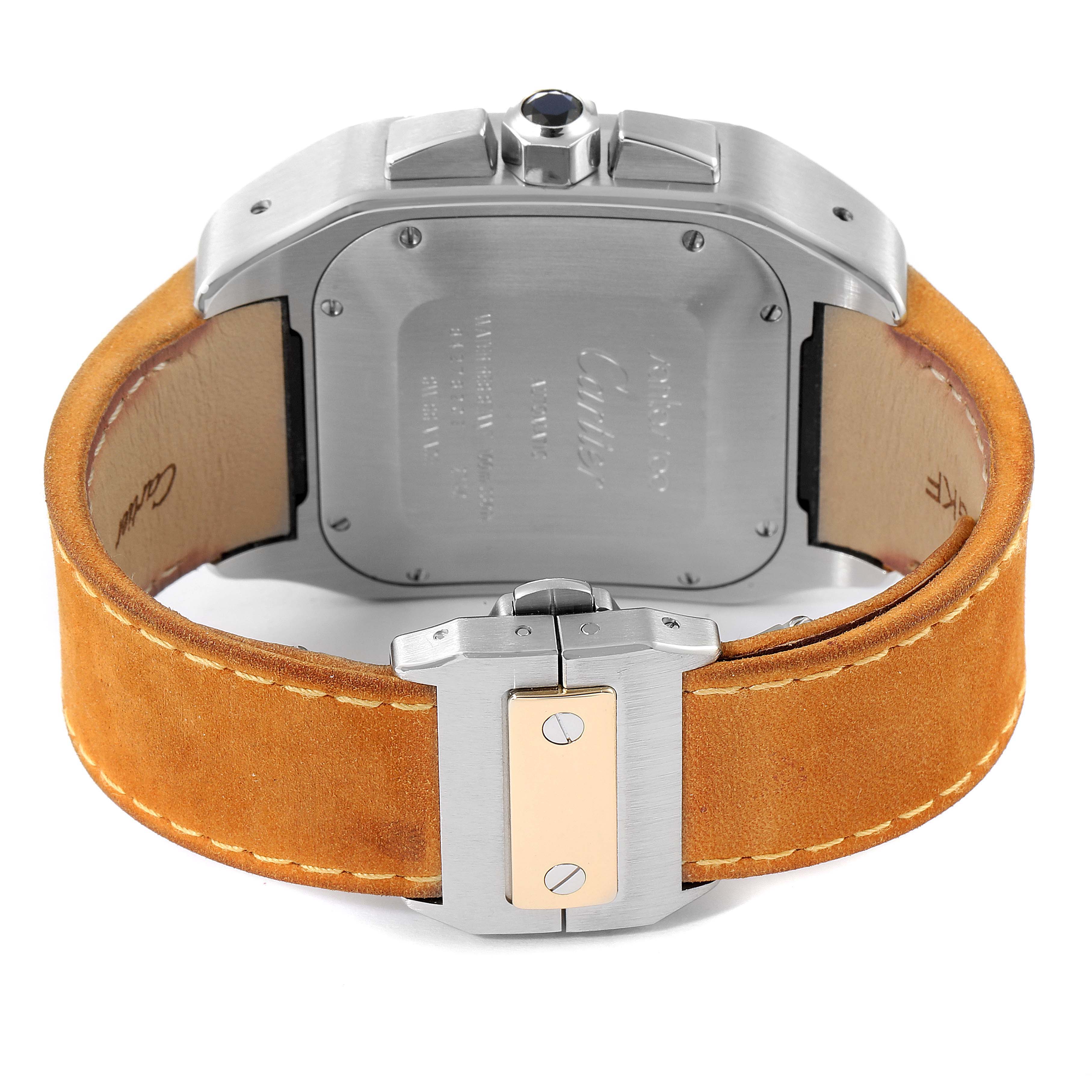 The image shows the back view of a Cartier Santos W20091X7 Men
s Steel and Gold (two tone) Silver Dial W20091X7 Men
s Steel and Gold (two tone) Silver Dial model watch, featuring its case back, crown, and leather strap with a clasp.