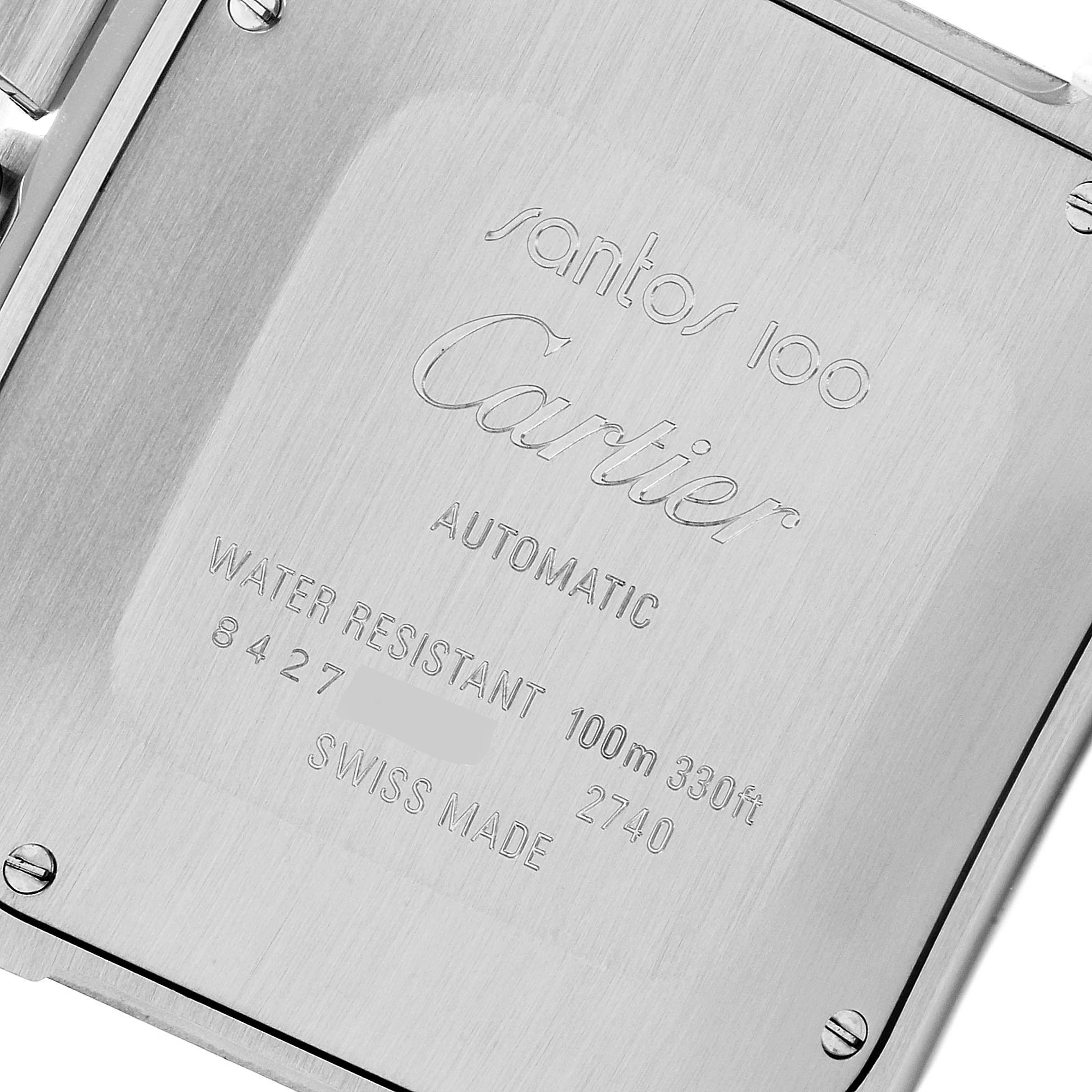 The image shows the back case of the Santos 100 model by Cartier with inscriptions about its specifications.
