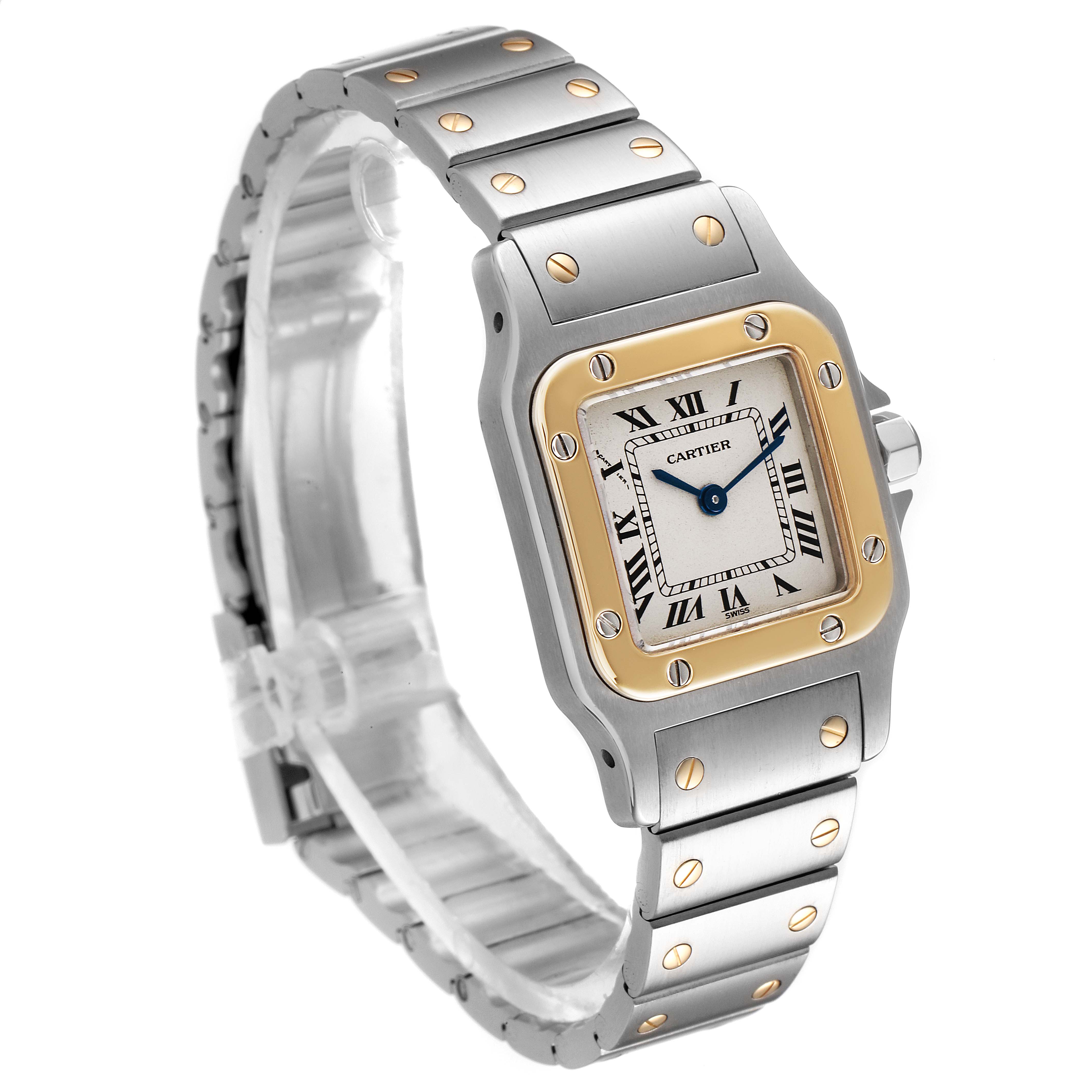 The image shows a three-quarter view of the Cartier Santos W20012C4 Women's Steel and Gold (two tone) Silver Dial W20012C4 Women's Steel and Gold (two tone) Silver Dial watch, displaying its face, bezel, crown, and bracelet.