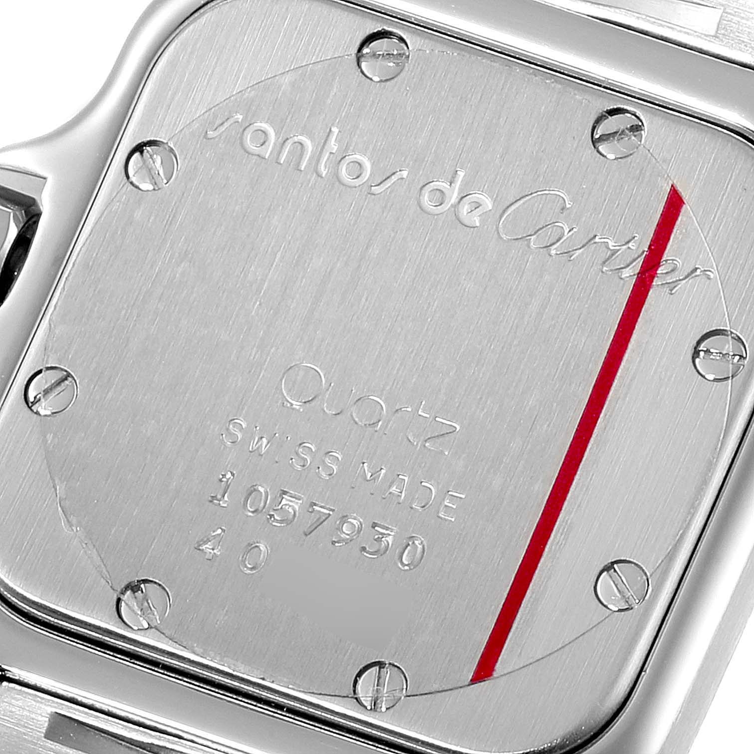 The image shows the back case of a Santos model by Cartier, including engraving details and screws.