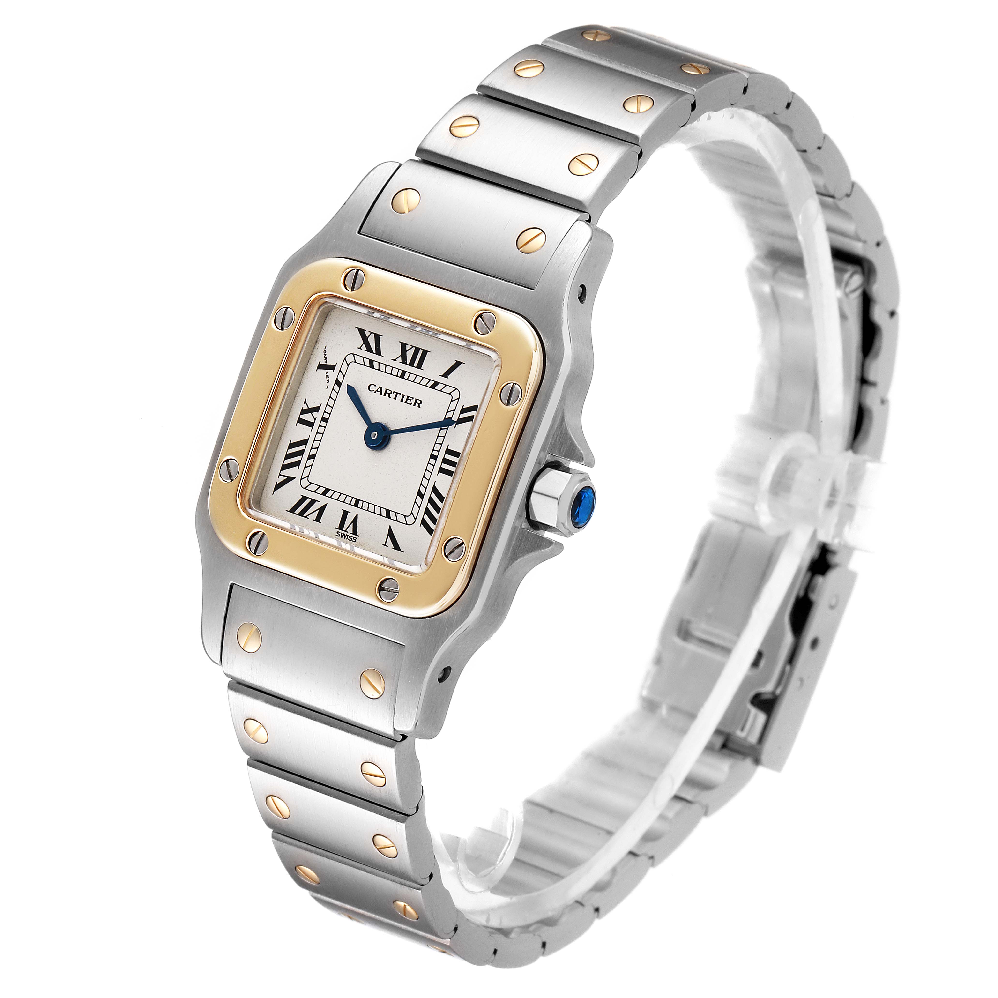 The image shows a Santos model by Cartier, at a slight angle, depicting its face, bezel, and metal bracelet.