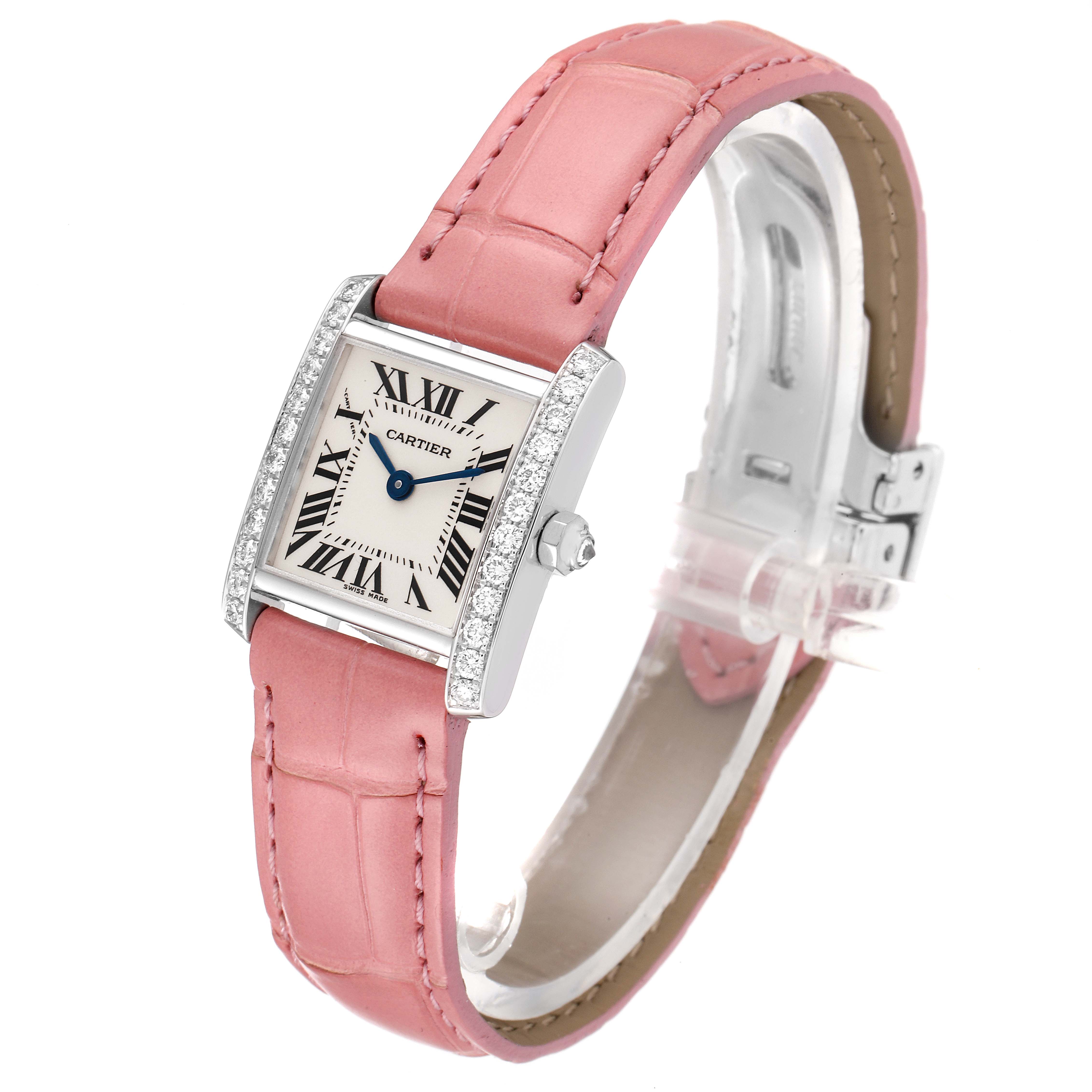 This image displays the Cartier Tank Francaise WE100251 Women
s White Gold Silver Dial WE100251 Women
s White Gold Silver Dial watch from a three-quarter angle, showcasing its pink leather strap and diamond-set case.