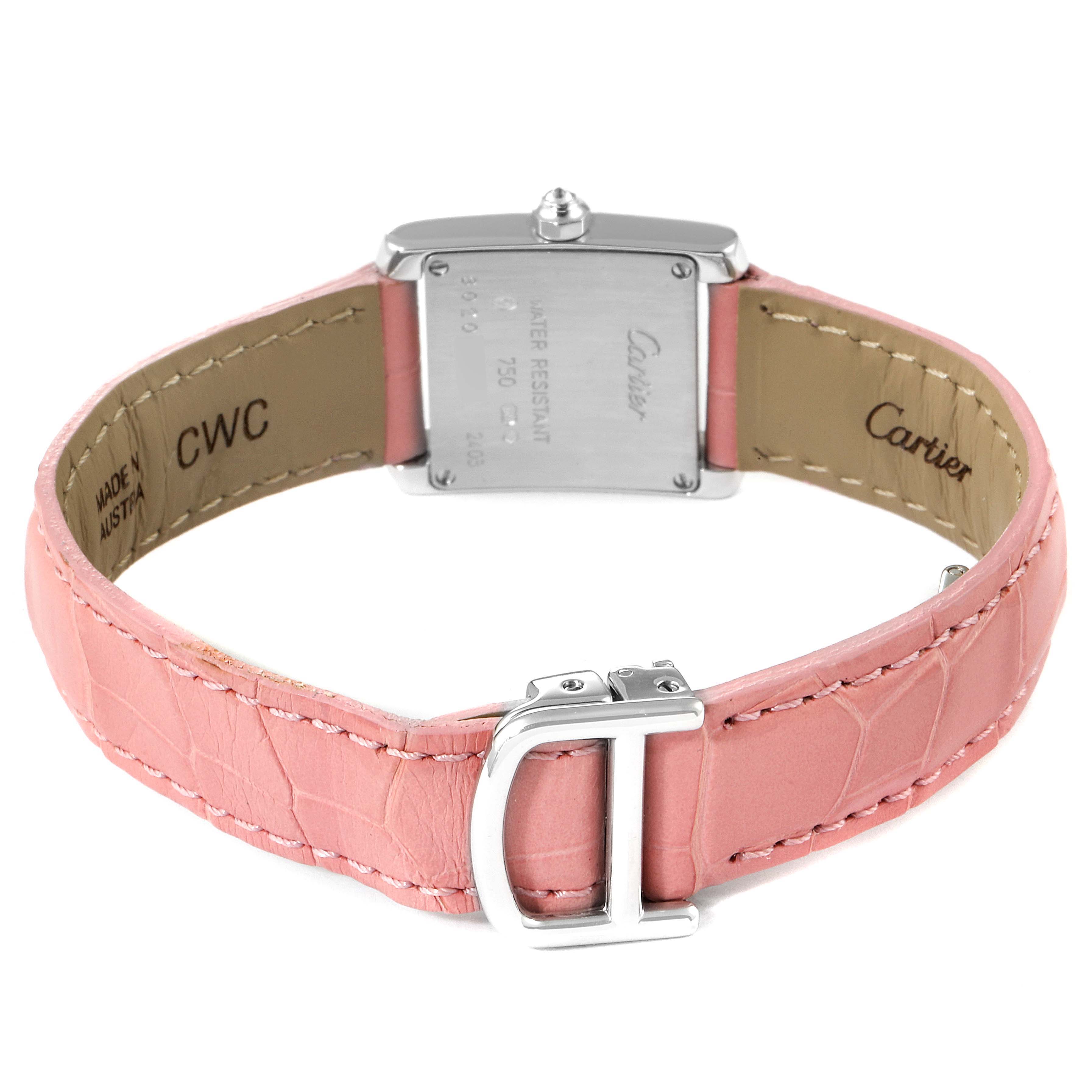 The image shows the back of a Cartier Tank Francaise WE100251 Women
s White Gold Silver Dial WE100251 Women
s White Gold Silver Dial watch with a pink leather strap.