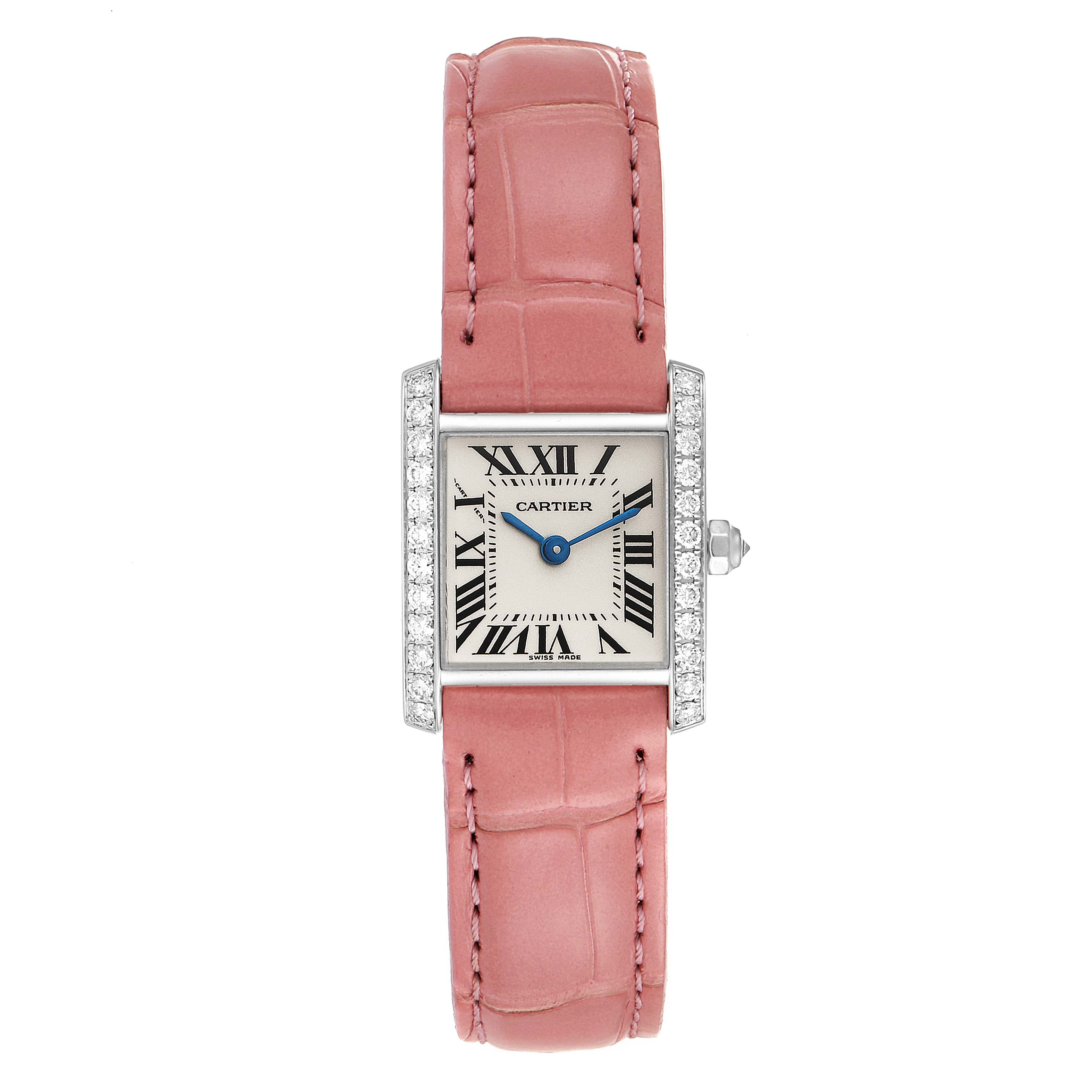 The Cartier Tank Française watch is shown from a top-down angle, featuring its rectangular face, pink strap, and side crown.