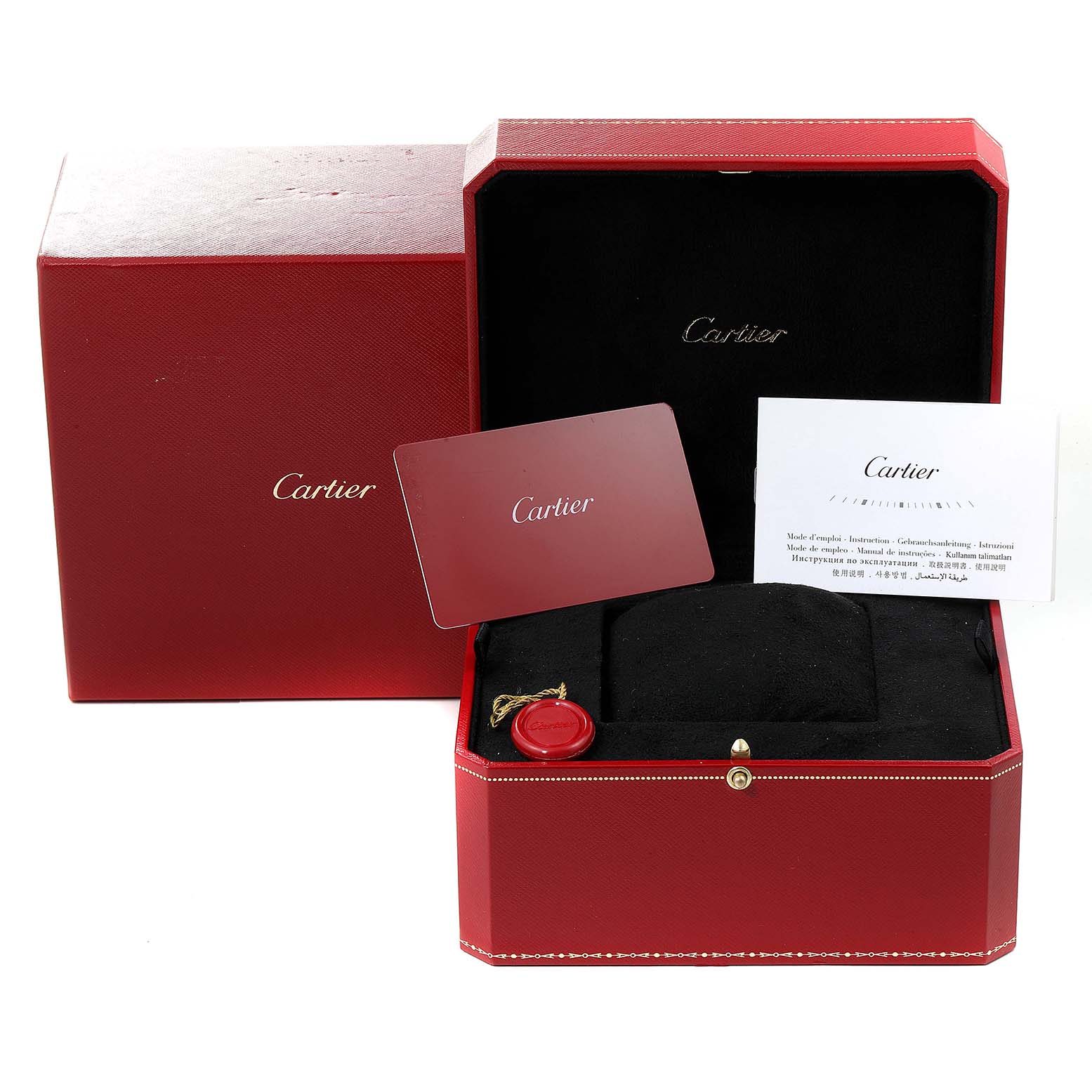 This image shows the box, cushion, cards, and tag for a Cartier Tank MC WSTA0010 Men's Stainless Steel Blue Dial WSTA0010 Men's Stainless Steel Blue Dial watch, from a frontal angle.