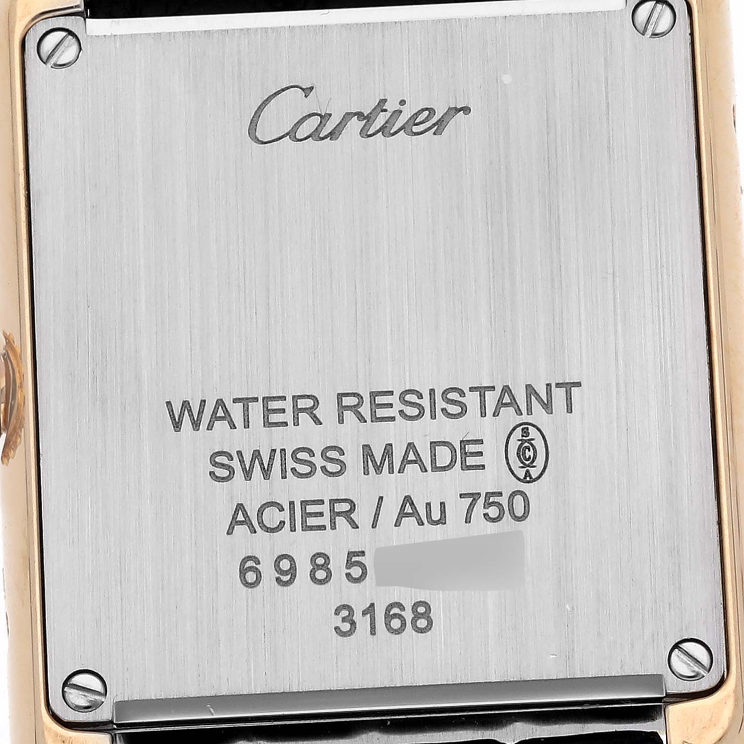 The image shows the case back of a Cartier Tank Solo W5200002 Women's Steel and Gold (two tone) Silver Dial W5200002 Women's Steel and Gold (two tone) Silver Dial watch, displaying branding and specifications.