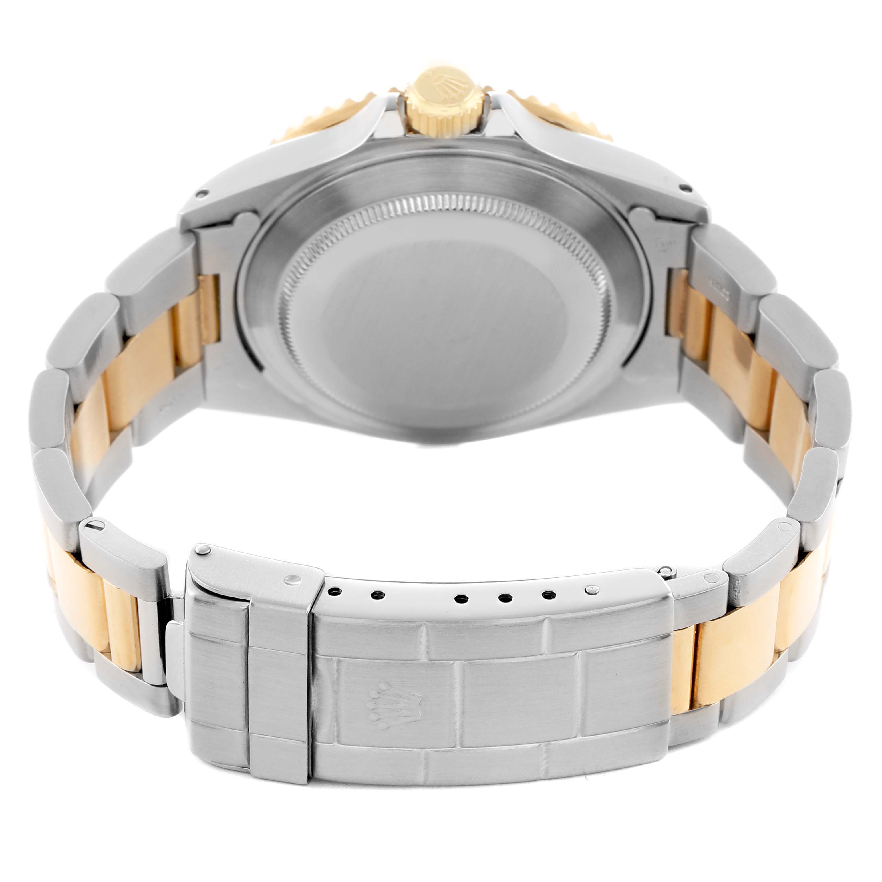 The image shows the back view of a Rolex Submariner 16613 Men
s Steel and Gold (two tone) Champagne Dial, displaying the case back, crown, and the two-tone bracelet with clasp.