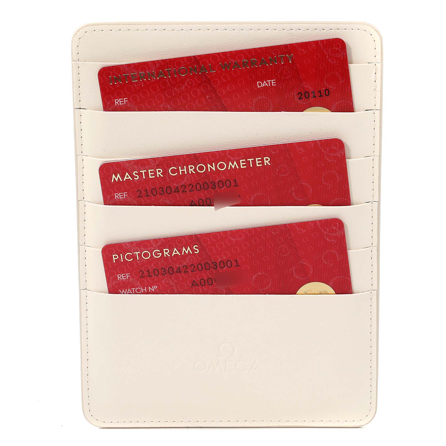 The image shows an off-white Omega cardholder containing warranty, chronometer, and pictogram cards for a Seamaster model watch.