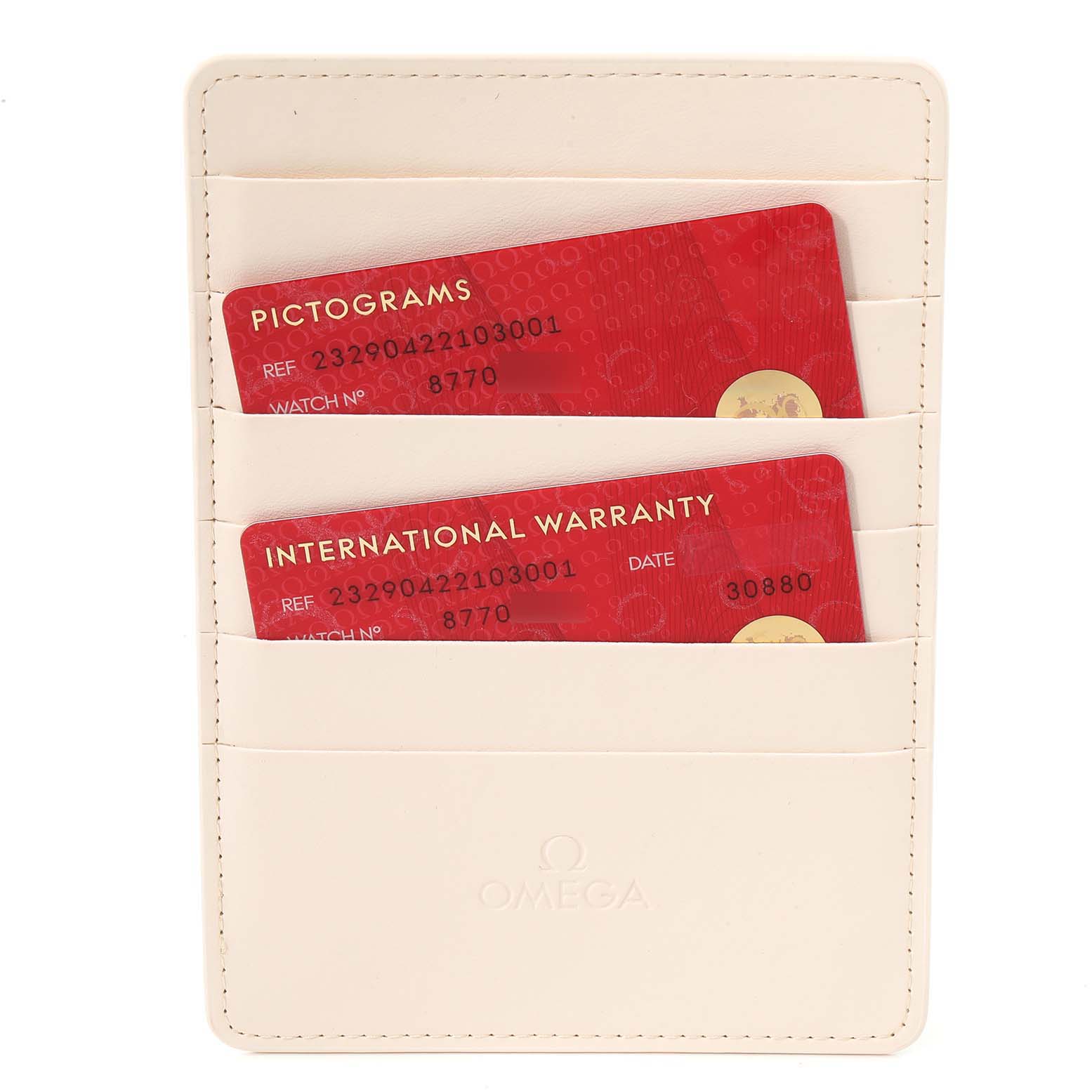 The image shows two red cards, labeled "PICTOGRAMS" and "INTERNATIONAL WARRANTY," in a white Omega holder for an Omega Planet Ocean 232.90.42.21.03.001 Men's Titanium Blue Dial 232.90.42.21.03.001 Men's Titanium Blue Dial model watch.