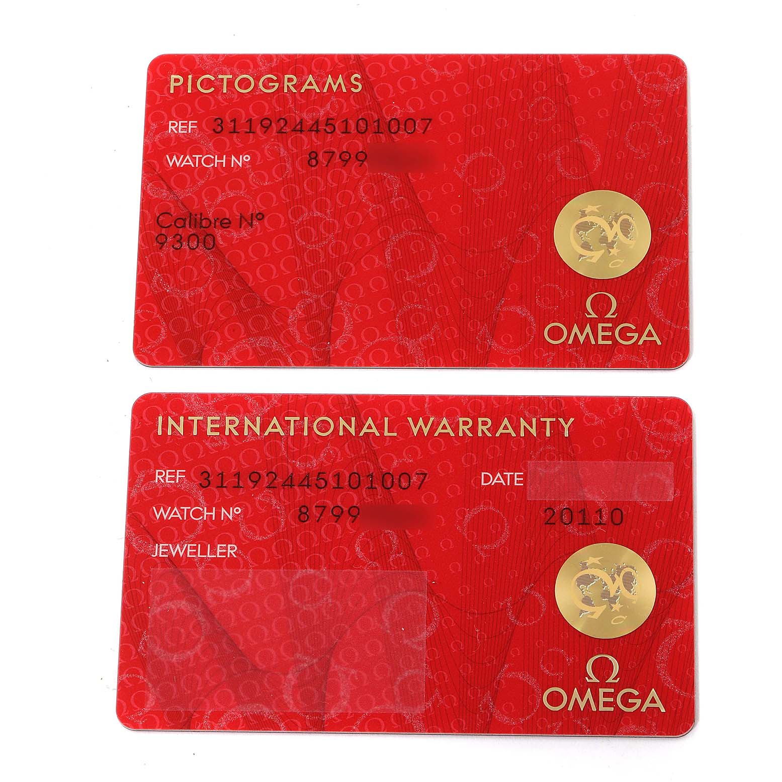 Two red Omega Speedmaster 311.92.44.51.01.007 Men's Ceramic Black Dial 311.92.44.51.01.007 Men's Ceramic Black Dial cards are shown: one for pictograms and the other for international warranty.