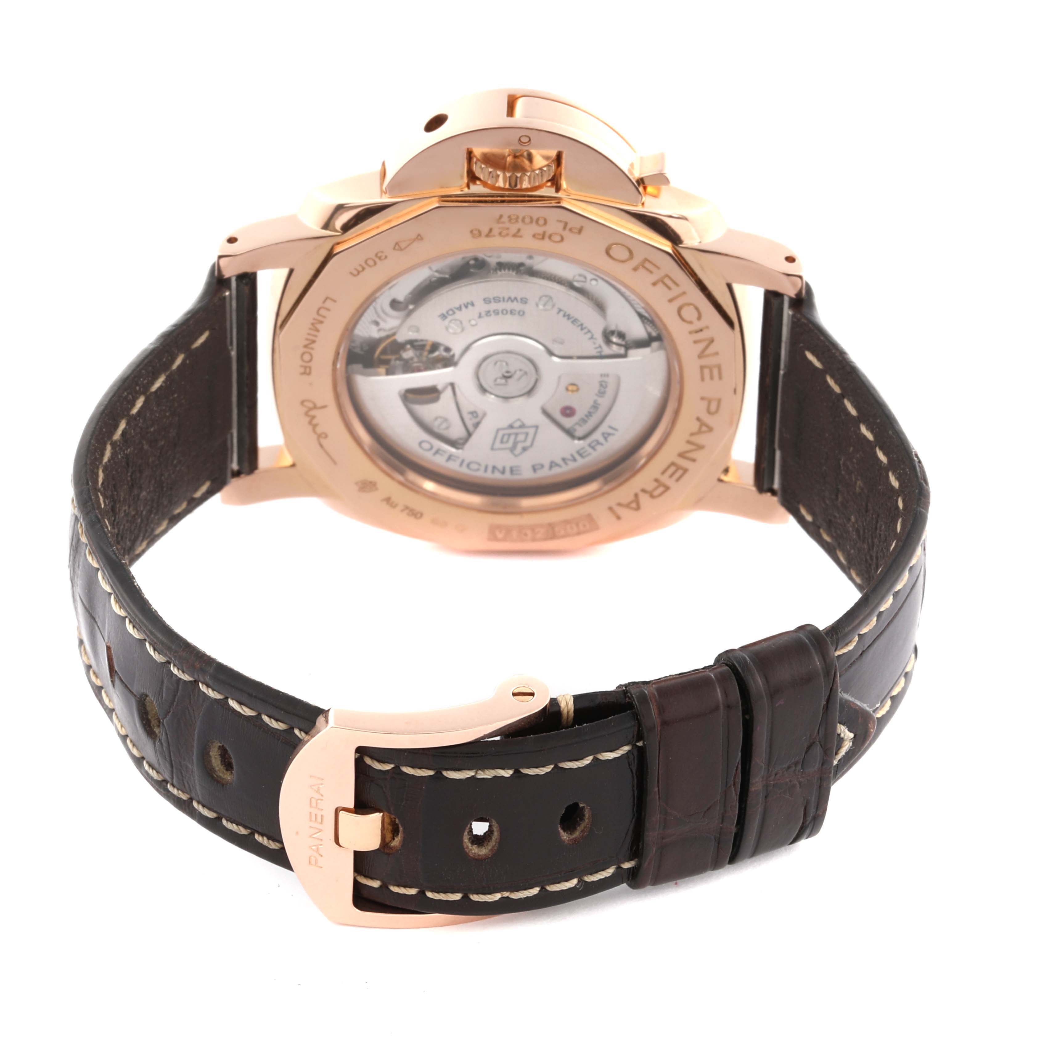 The Panerai Luminor PAM01042 Men's Rose Gold White Dial PAM01042 Men's Rose Gold White Dial watch is shown from the back, displaying the transparent case back and leather strap.