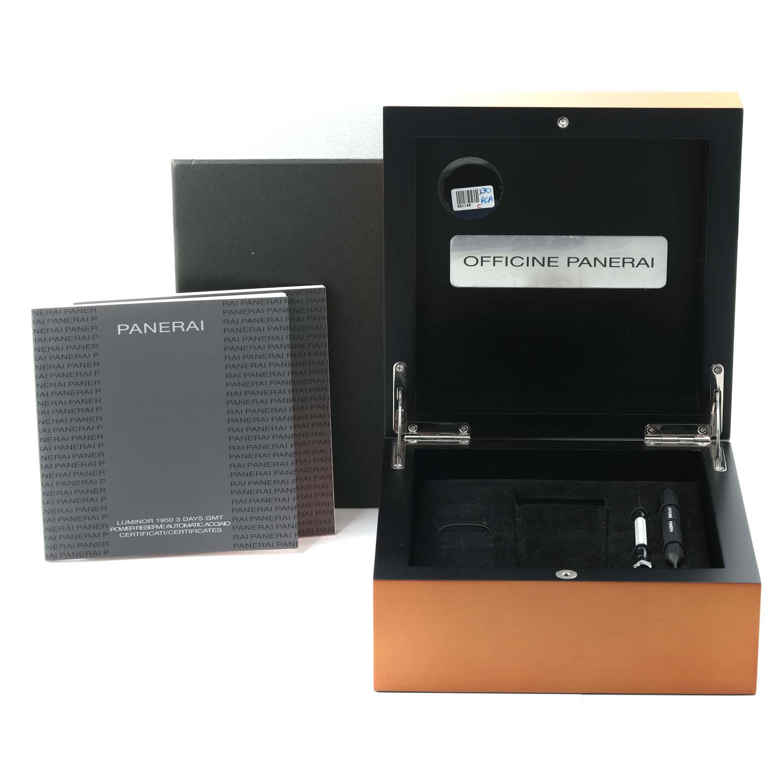 The image shows an open Luminor Panerai watch box, manual, and watch accessories like tools.
