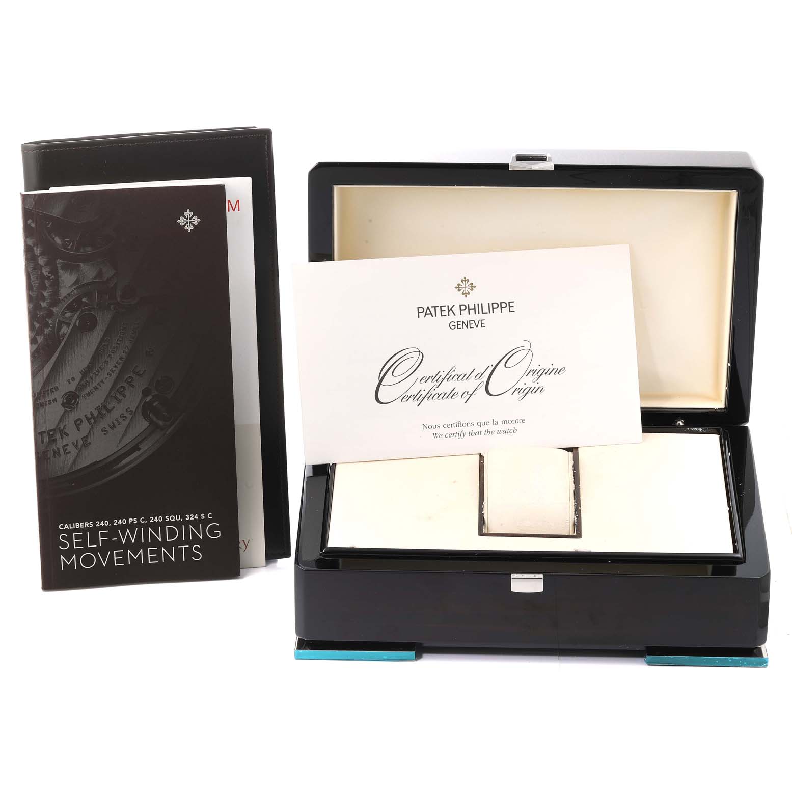 The image shows a Patek Philippe Calatrava 5153G Men
s White Gold Silver Dial 5153G Men
s White Gold Silver Dial watch box, accompanying booklets, and a certificate of origin.