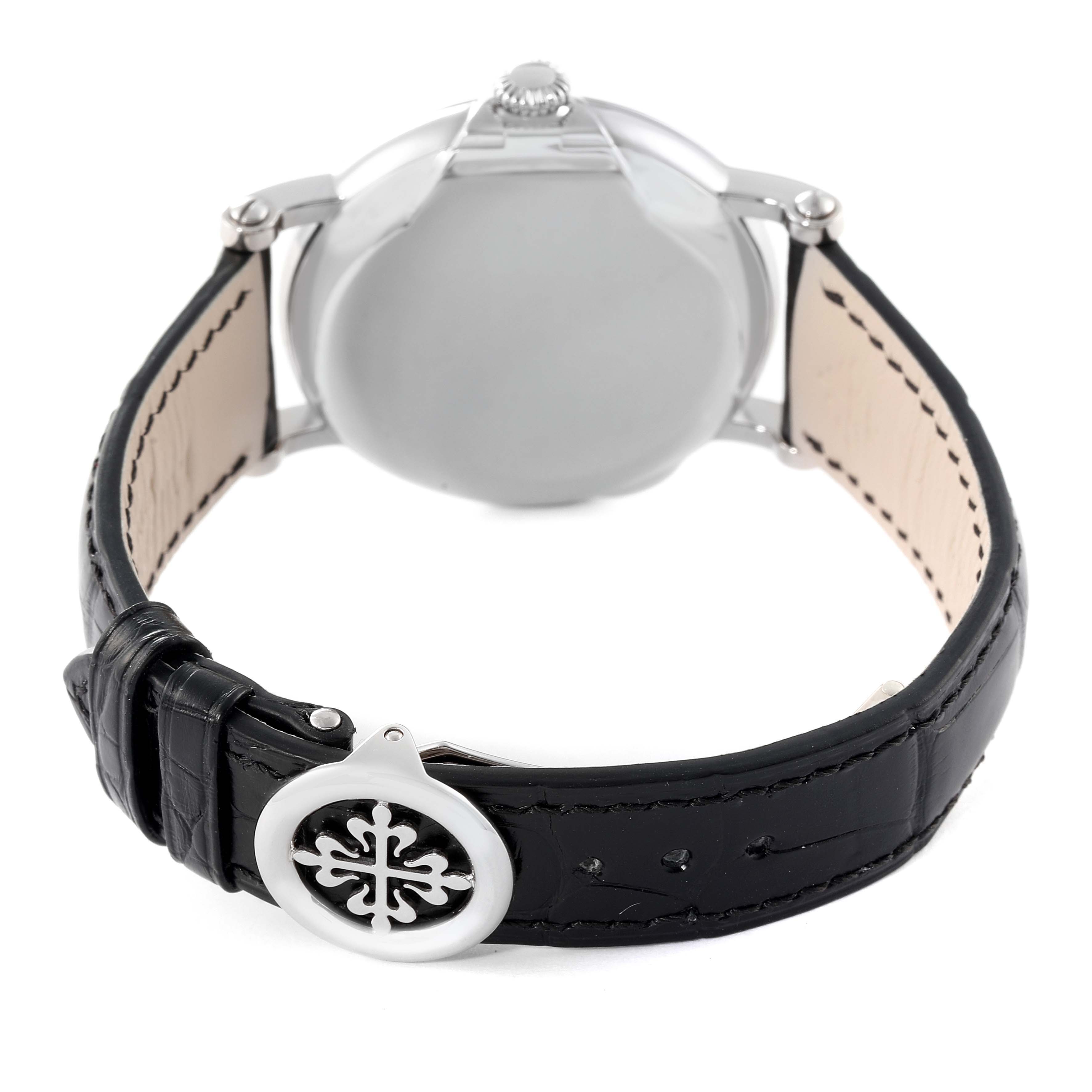 The image shows the back view of a Patek Philippe Calatrava 5153G Men
s White Gold Silver Dial 5153G Men
s White Gold Silver Dial watch, highlighting the case back and the black leather strap with the clasp.
