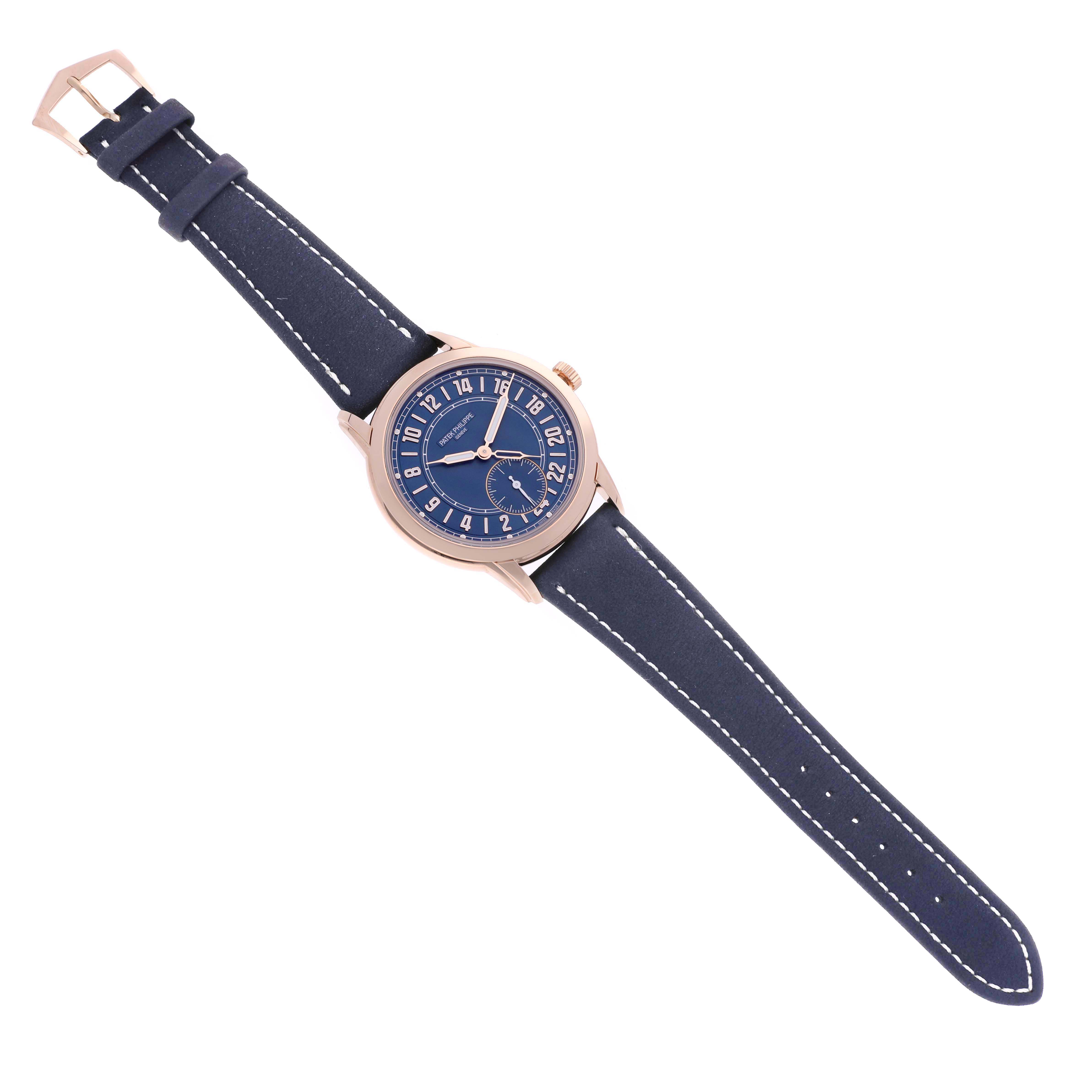 The Patek Philippe Calatrava 5224R-001 Men
s Rose Gold Blue Dial 5224R-001 Men
s Rose Gold Blue Dial watch is shown from a top-down angle, displaying the face, case, and full leather strap.