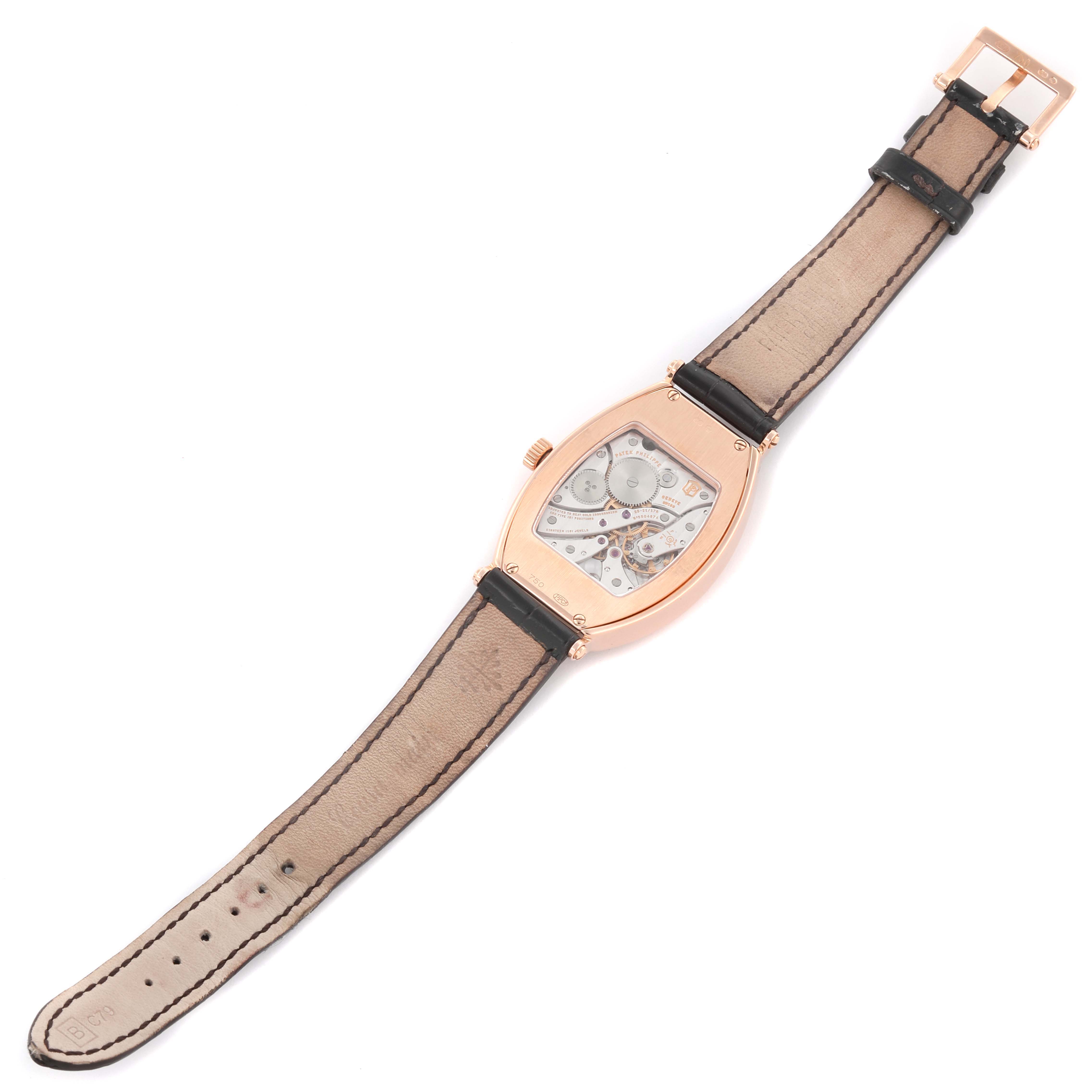 The Patek Philippe Gondolo 5098R-001 Men's Rose Gold Silver Dial 5098R-001 Men's Rose Gold Silver Dial watch is shown from the back, highlighting the movement and leather strap.