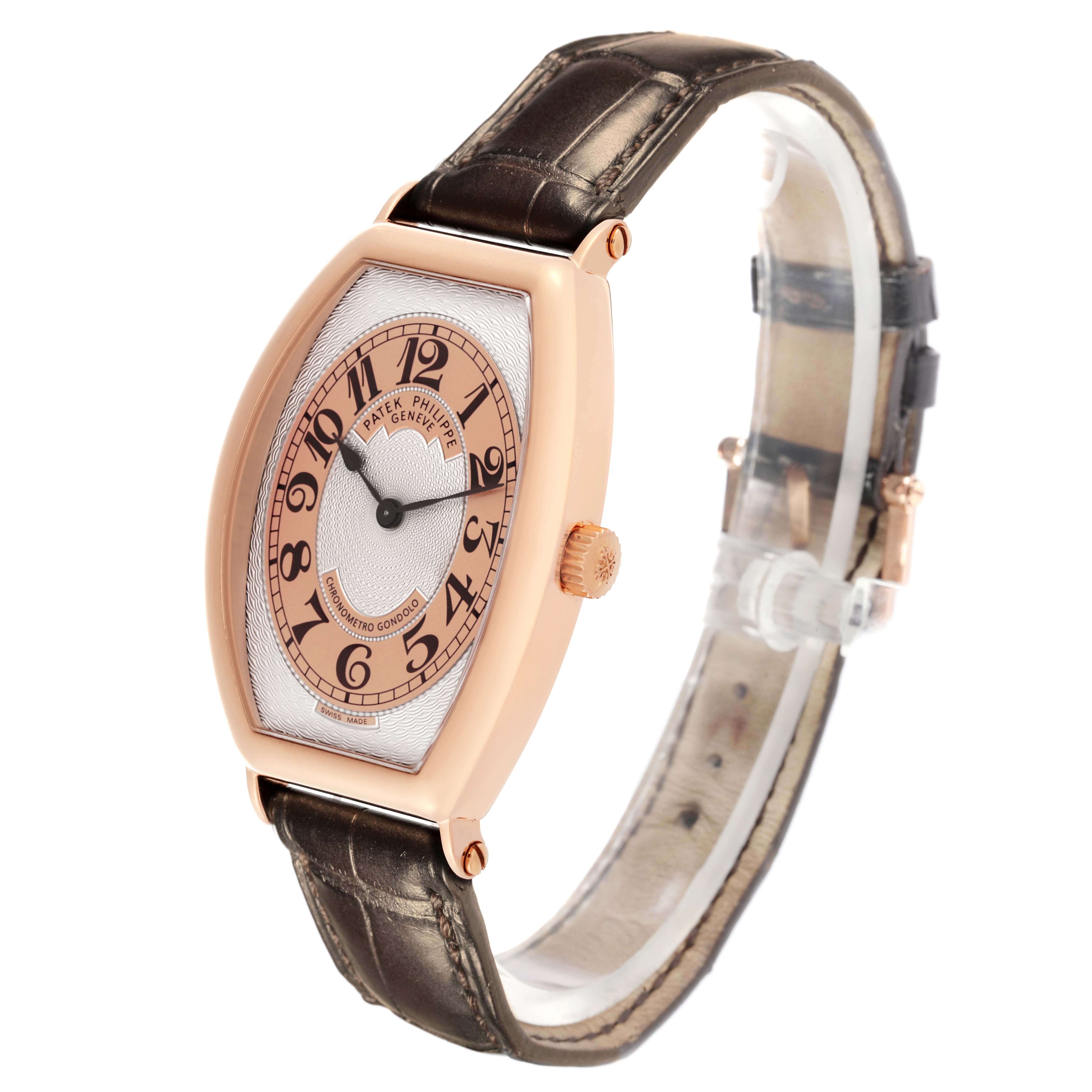 The Patek Philippe Gondolo 5098R-001 Men's Rose Gold Silver Dial 5098R-001 Men's Rose Gold Silver Dial watch is shown at a three-quarter angle, highlighting the dial, case, strap, and crown.
