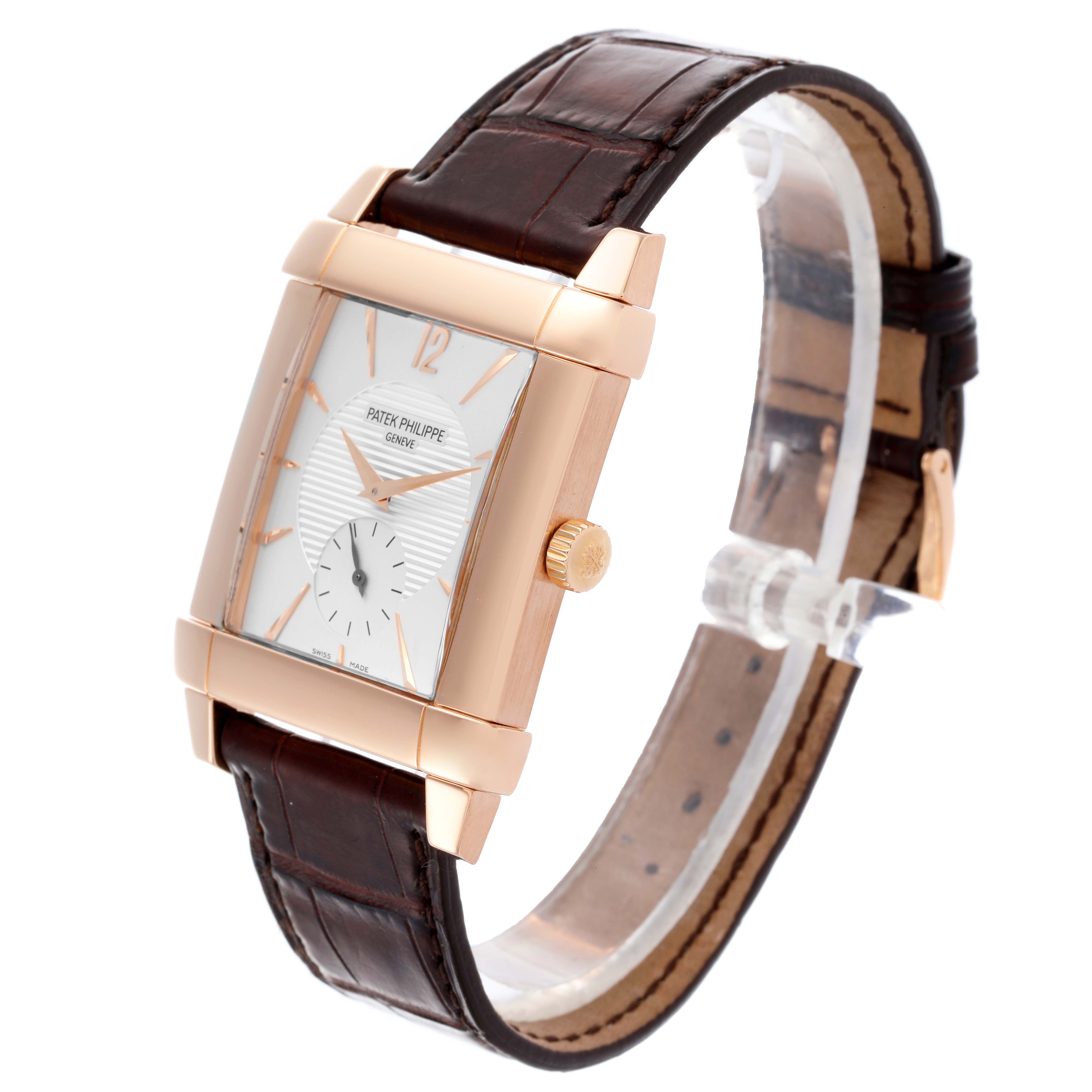 The image shows a side angle of the Patek Philippe Gondolo 5111R-001 Men's Rose Gold Silver Dial 5111R-001 Men's Rose Gold Silver Dial watch, highlighting its rectangular case, crown, and leather strap.