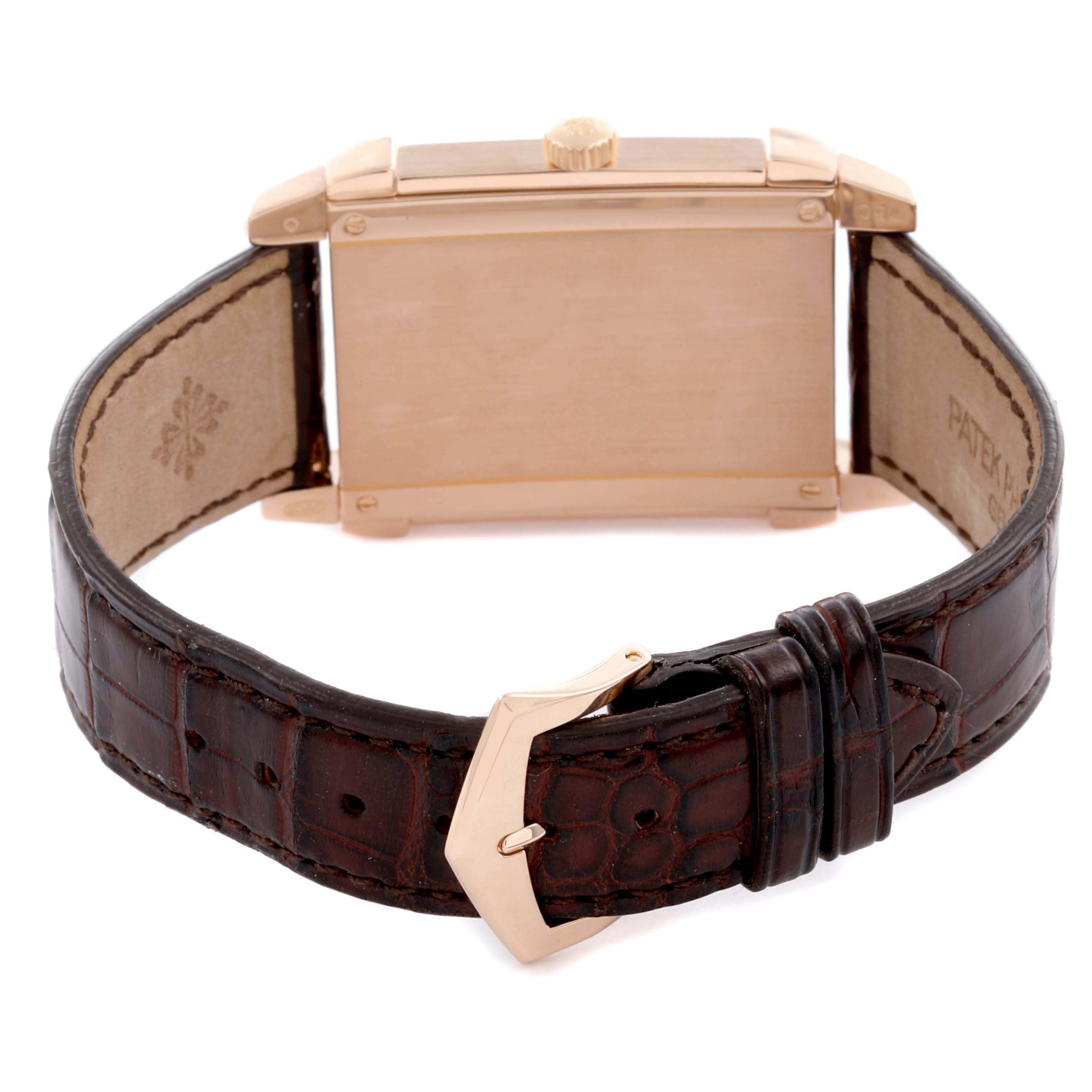 The image shows the back view of a Patek Philippe Gondolo 5111R-001 Men's Rose Gold Silver Dial 5111R-001 Men's Rose Gold Silver Dial watch, highlighting the case, crown, and leather strap with a buckle.