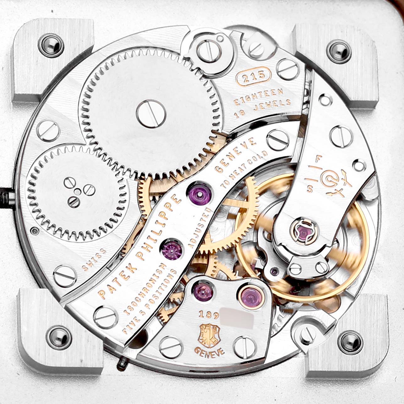 This image shows the intricate movement and inner workings of the Patek Philippe Gondolo 5111R-001 Men's Rose Gold Silver Dial 5111R-001 Men's Rose Gold Silver Dial watch from a top-down angle.