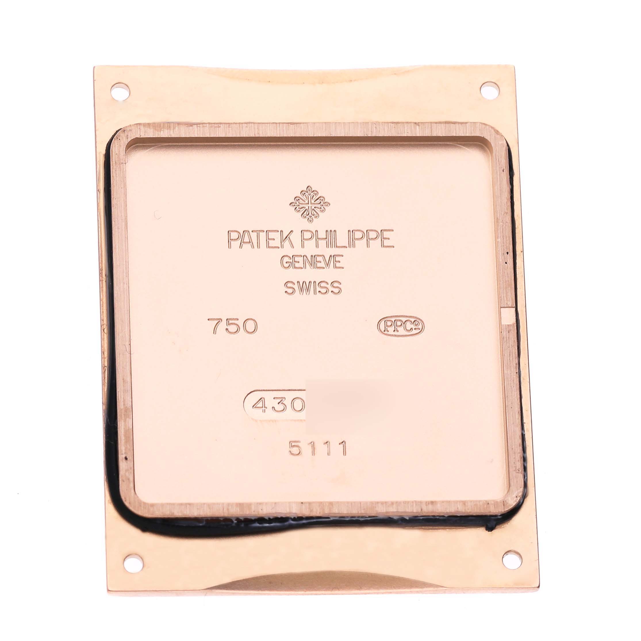 This is the back panel of a Patek Philippe Gondolo 5111R-001 Men's Rose Gold Silver Dial 5111R-001 Men's Rose Gold Silver Dial watch, showing inscriptions and markings.