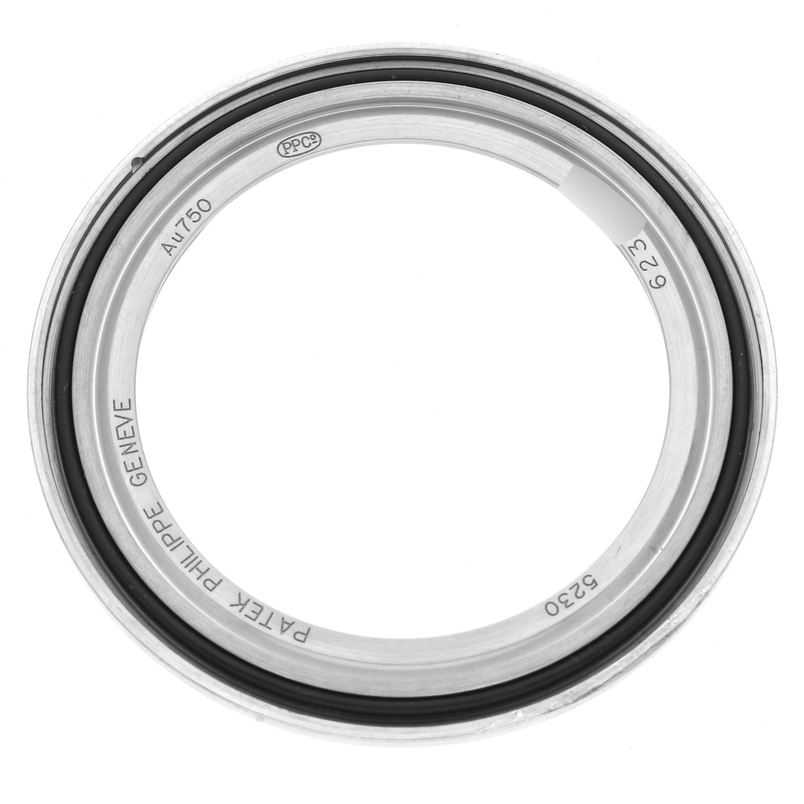 This image shows the bezel, a part of the Patek Philippe Complications 5230G-001 Men's White Gold Grey Dial 5230G-001 Men's White Gold Grey Dial watch, viewed from above.