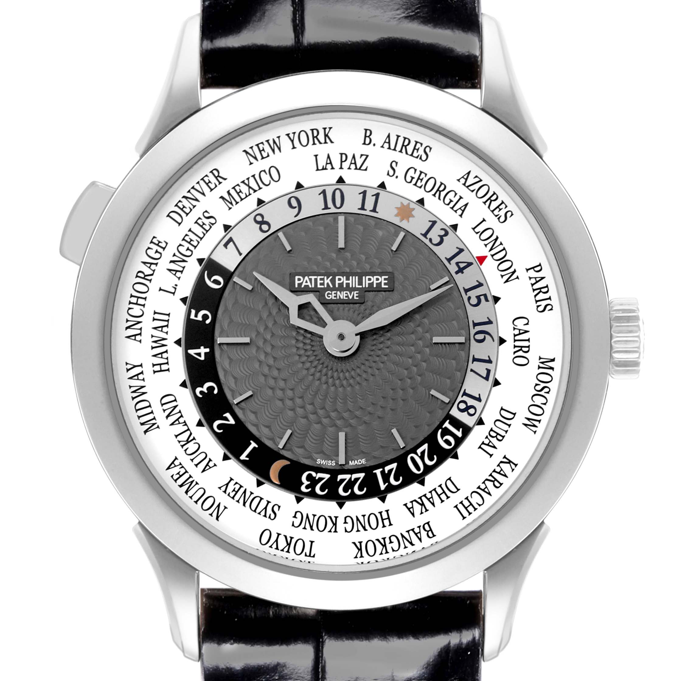 The image shows a front view of the Patek Philippe Complications 5230G-001 Men's White Gold Grey Dial 5230G-001 Men's White Gold Grey Dial watch, highlighting the dial and world time feature.