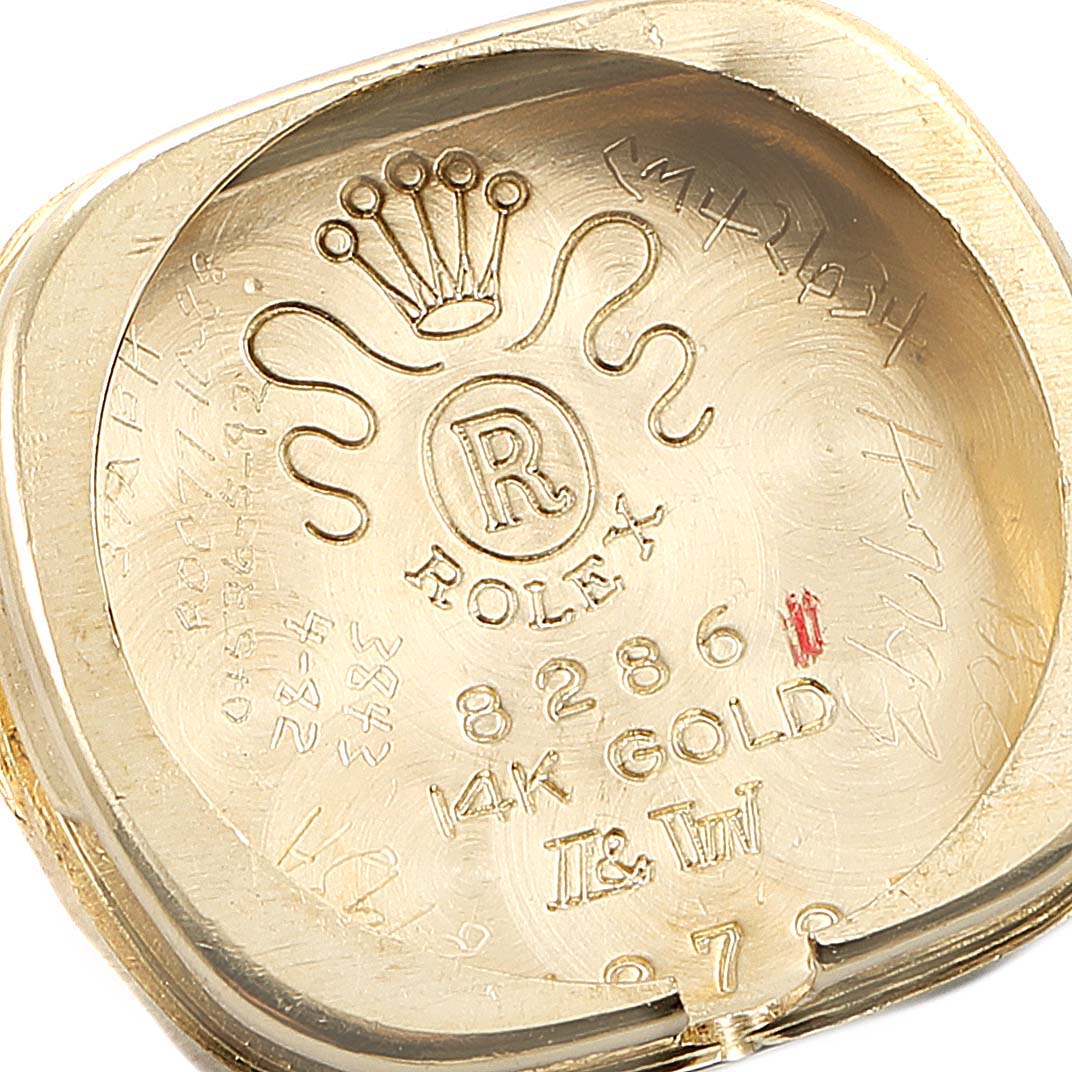 This image shows the inner case back of a Rolex Cocktail Women
s Yellow Gold Champagne Dial Women
s Yellow Gold Champagne Dial model watch, highlighting the brand and material engravings.