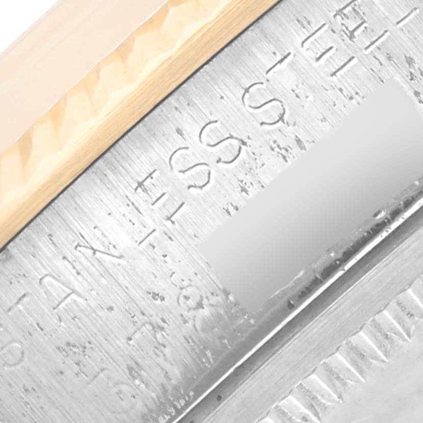 The image shows a close-up of the Rolex Vintage Collection 5701 Men's Steel and Gold (two tone) Silver Dial 5701 Men's Steel and Gold (two tone) Silver Dial watch's bezel, focusing on engraved text.