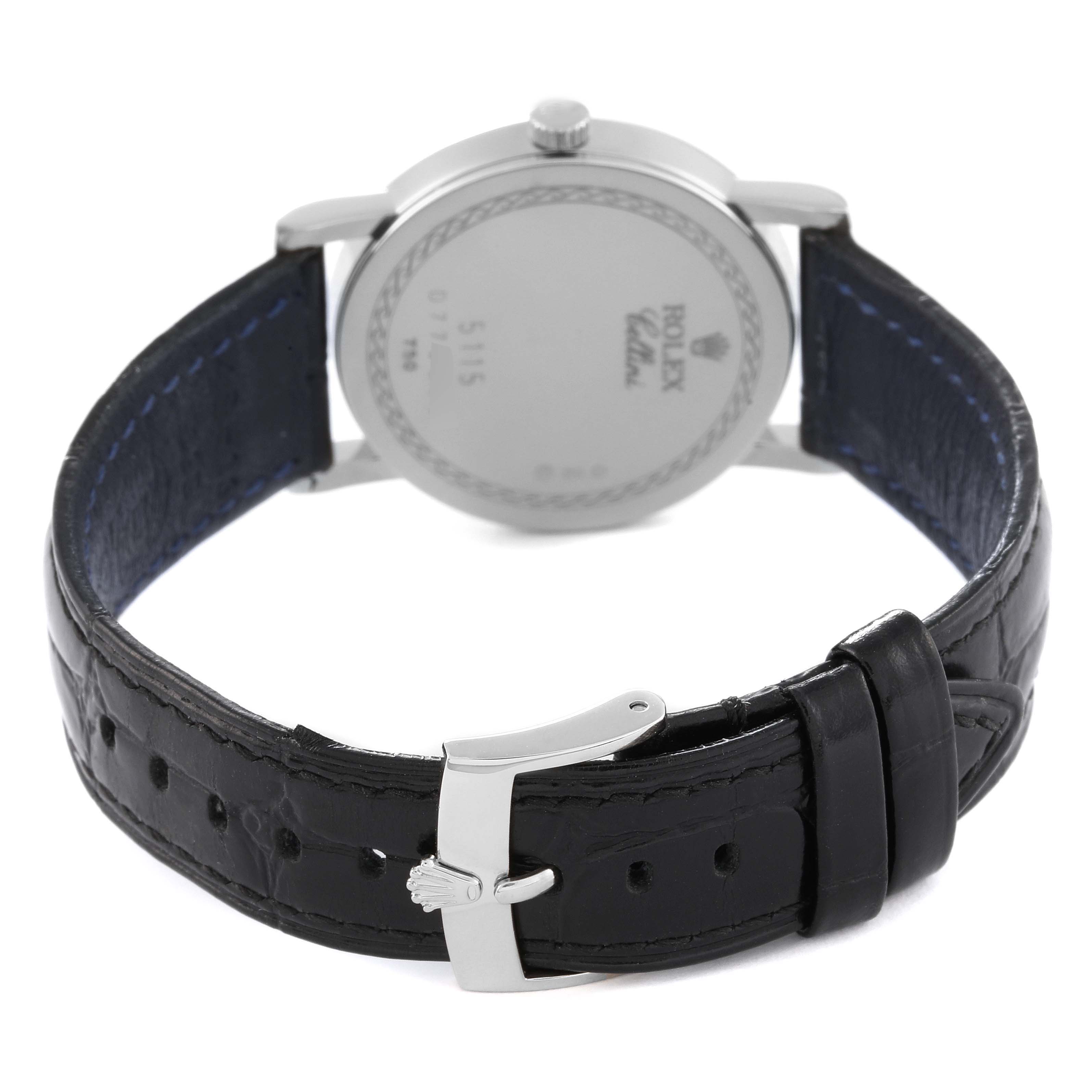 This image shows the back view of a Rolex Cellini 5115 Men
s Stainless Steel Silver Dial 5115 Men
s Stainless Steel Silver Dial watch, focusing on the case back and leather strap with its clasp.