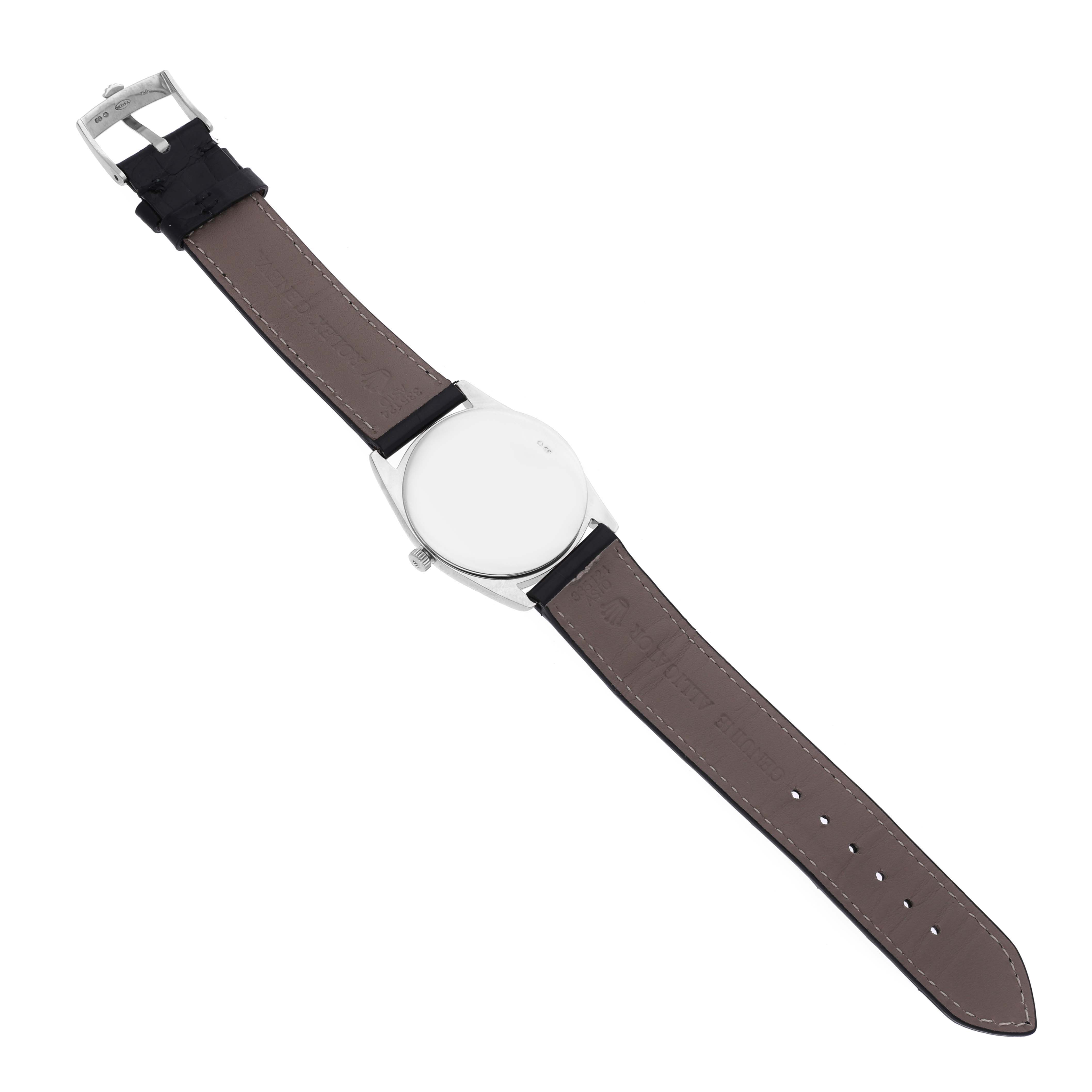 The Rolex Cellini 4233 Men's White Gold White Dial 4233 Men's White Gold White Dial watch is shown from the underside, highlighting the strap and clasp.