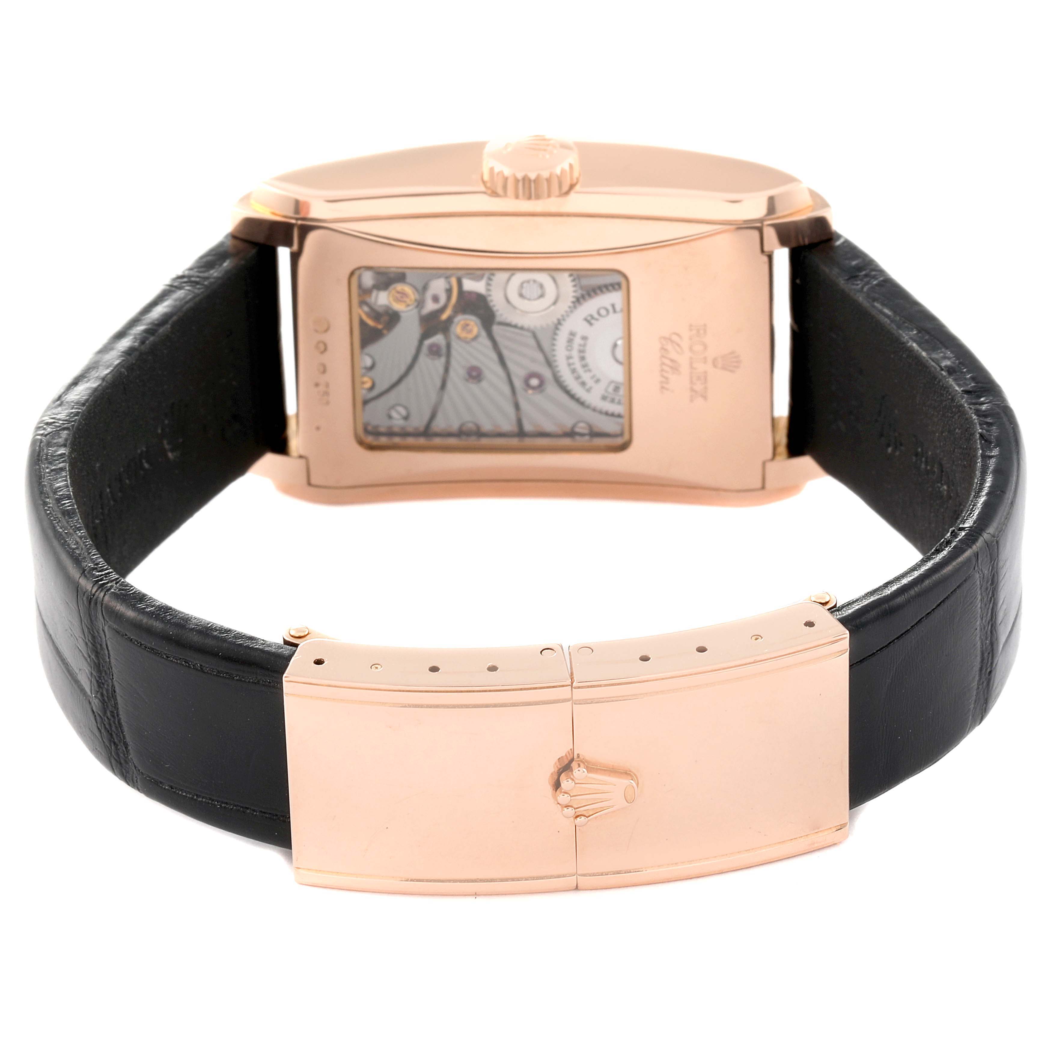 The image shows the back view of a Rolex Cellini 5442 Men's Rose Gold Black Dial 5442 Men's Rose Gold Black Dial watch, showcasing its intricate movement, strap, and clasp.