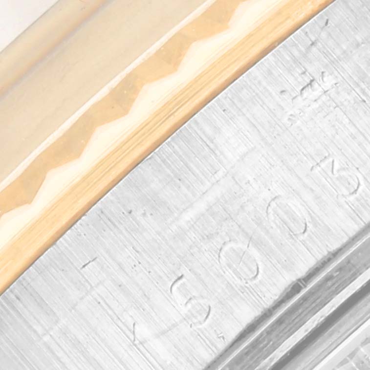 The image shows a close-up of the engraved edge of a Rolex Vintage Collection 15003 Men's Steel and Gold (two tone) Champagne Dial 15003 Men's Steel and Gold (two tone) Champagne Dial watch.