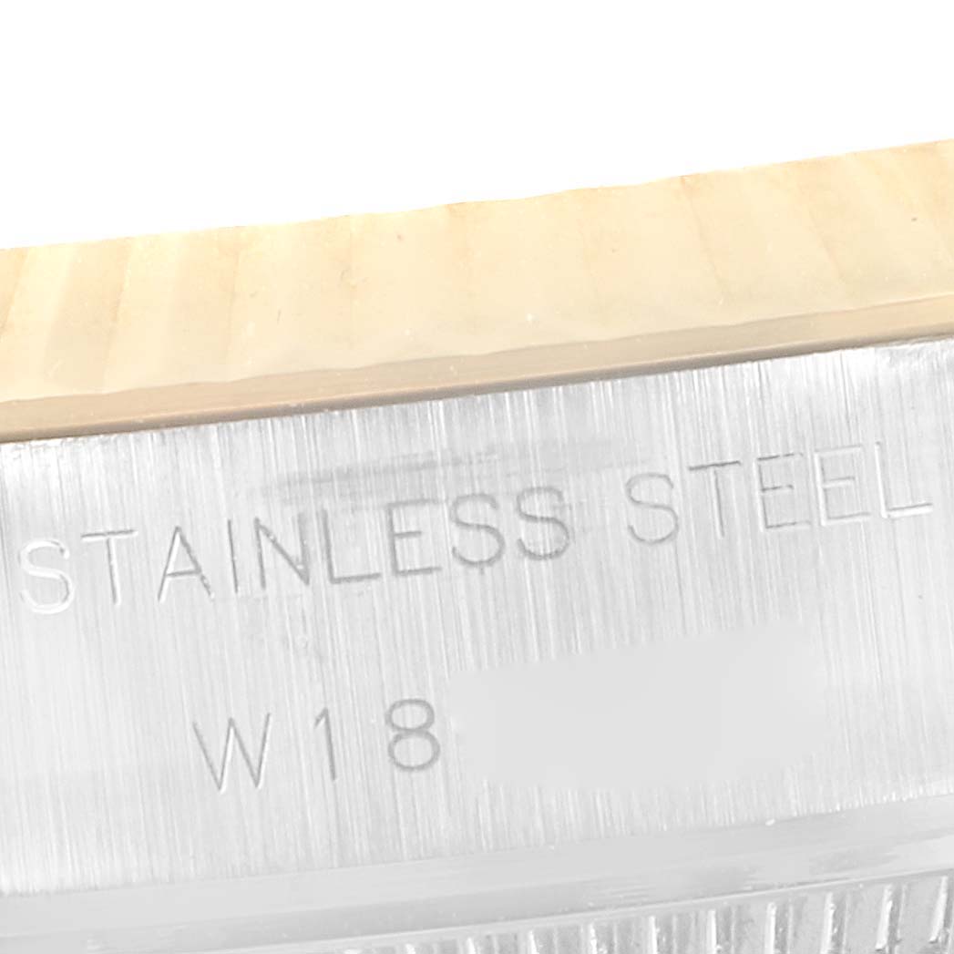 This image shows a close-up of the side of the Rolex Datejust 69173 Women's Steel and Gold (two tone) Champagne Dial 69173 Women's Steel and Gold (two tone) Champagne Dial watch, focusing on the stainless steel material marking.