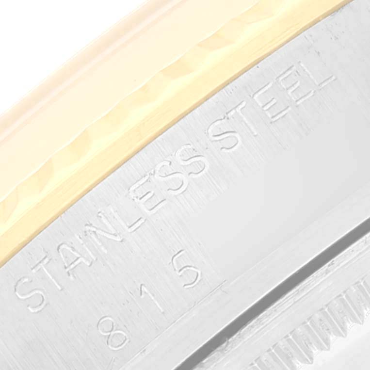 The image shows a close-up angle of the edge of a Rolex Vintage Collection 16013 Men
s Steel and Gold (two tone) Champagne Dial 16013 Men
s Steel and Gold (two tone) Champagne Dial watch, highlighting the stainless steel marking.