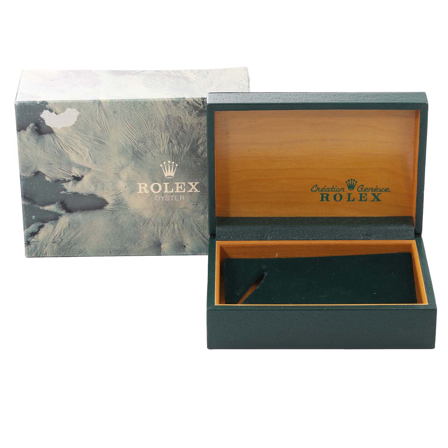 The image shows an open Rolex box for the Vintage Collection model, with a green exterior, wooden interior, and a marble-patterned outer box.