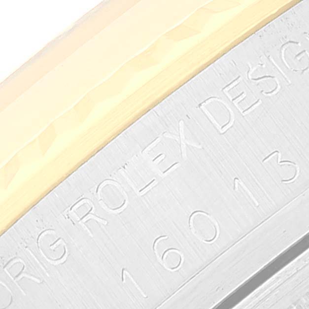 This close-up image shows the engraved serial number and "ORIG ROLEX DESIGN" on the side of a Rolex Vintage Collection 16013 Men
s Steel and Gold (two tone) Champagne Dial 16013 Men
s Steel and Gold (two tone) Champagne Dial model.