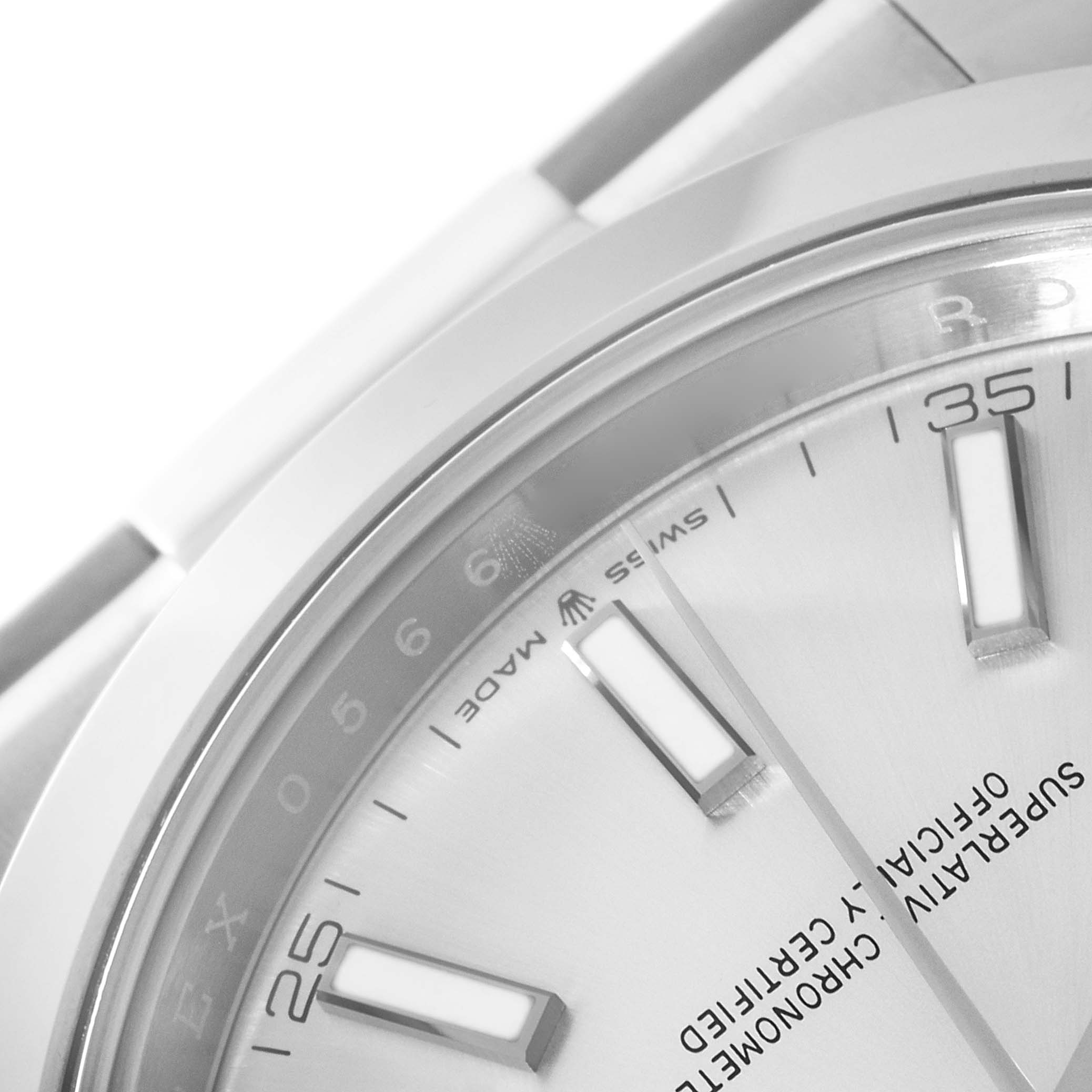 This close-up image of the Rolex Datejust 41 126300 Men's Stainless Steel Silver Dial 126300 Men's Stainless Steel Silver Dial watch shows part of the dial with hour markers and part of the bezel.
