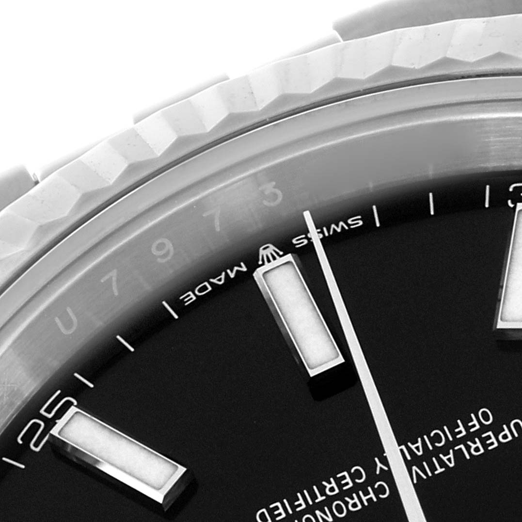 This close-up shows the Rolex Datejust 41 126334 Men's Stainless Steel Black Dial 126334 Men's Stainless Steel Black Dial bezel, dial edge, and markers from an angled top-down view.