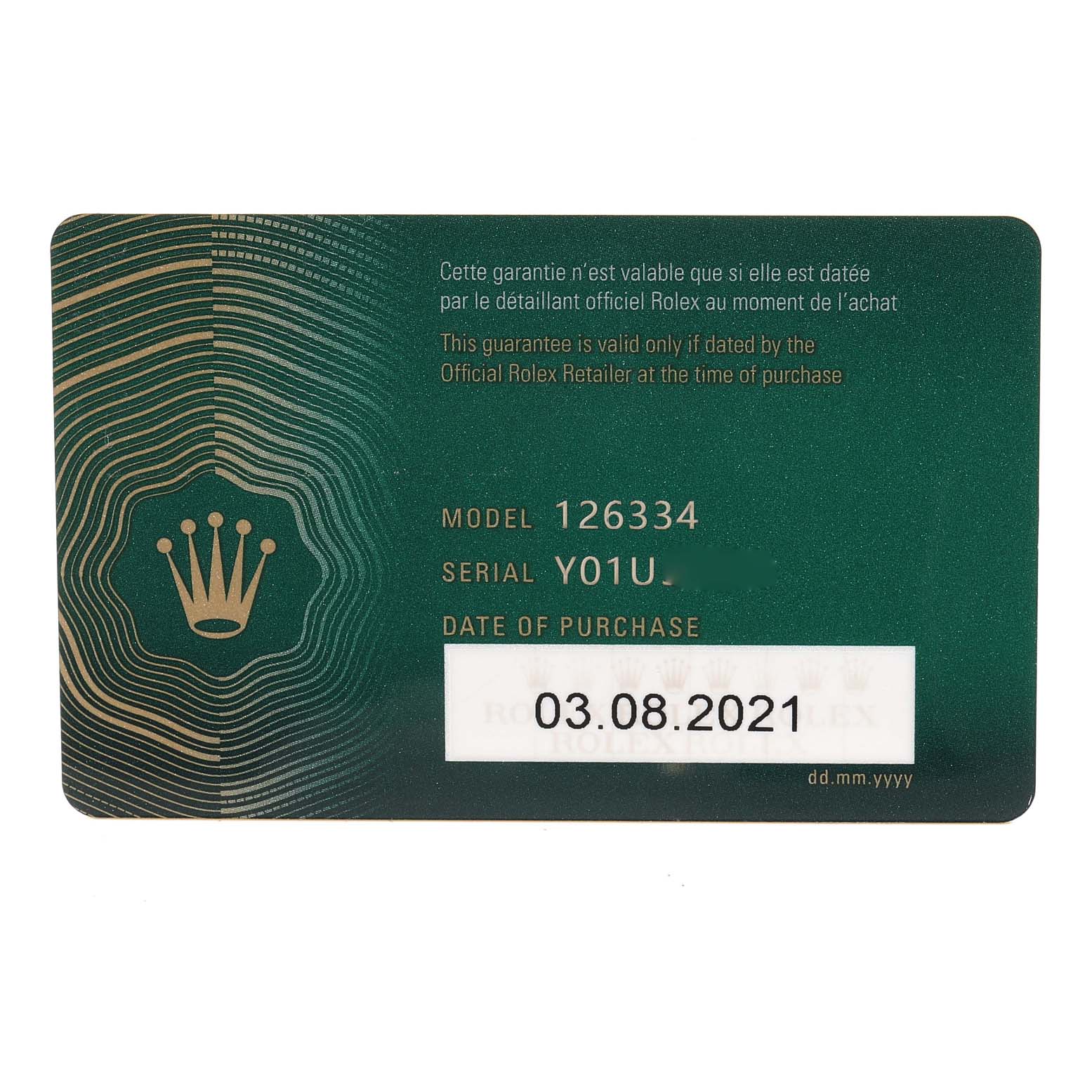 This image shows the green warranty card for the Rolex Datejust 41 126334 Men
s Stainless Steel Blue Dial 126334 Men
s Stainless Steel Blue Dial model 126334 with a serial number and purchase date.