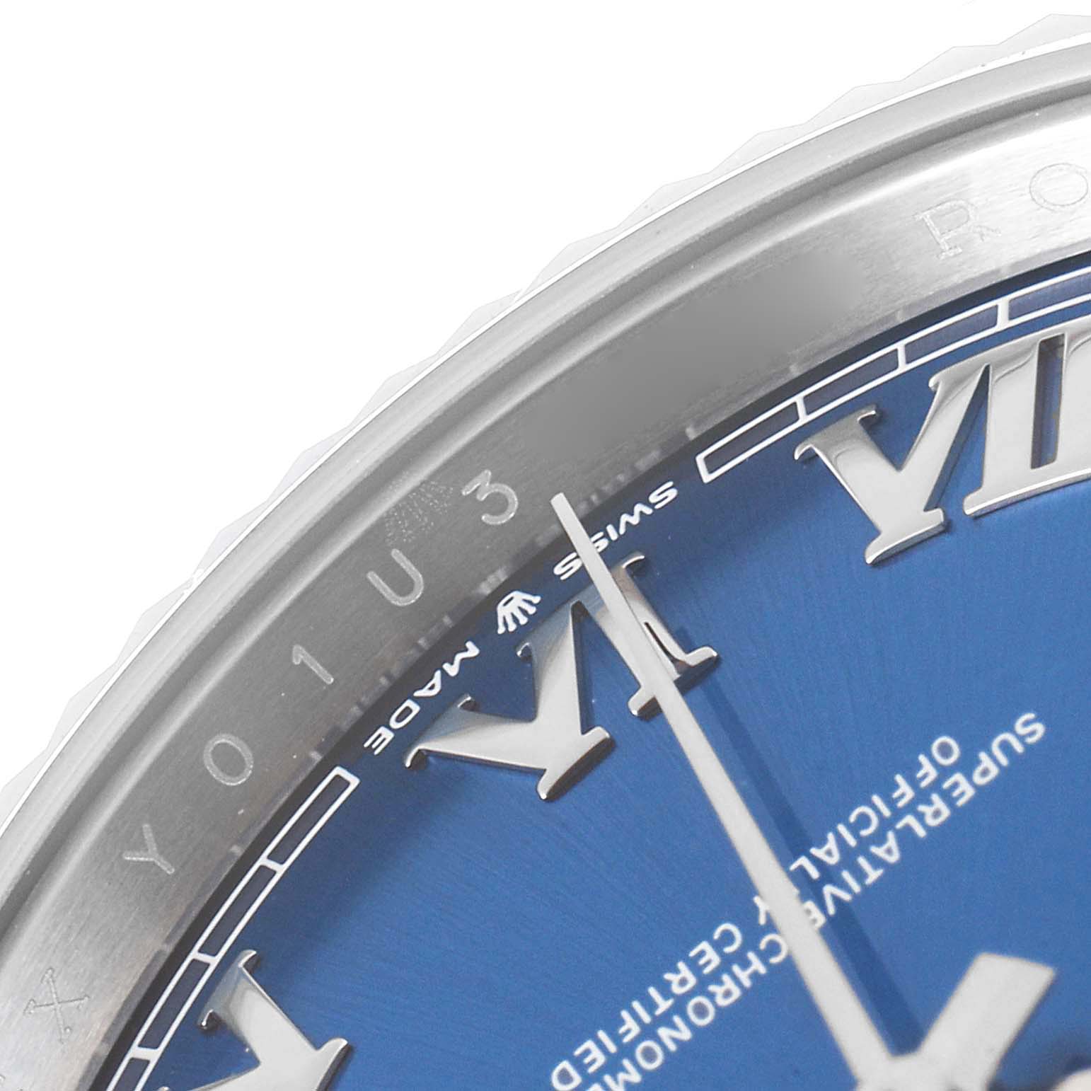 This close-up image of the Rolex Datejust 41 126334 Men
s Stainless Steel Blue Dial 126334 Men
s Stainless Steel Blue Dial watch shows part of the bezel and blue dial with Roman numerals.
