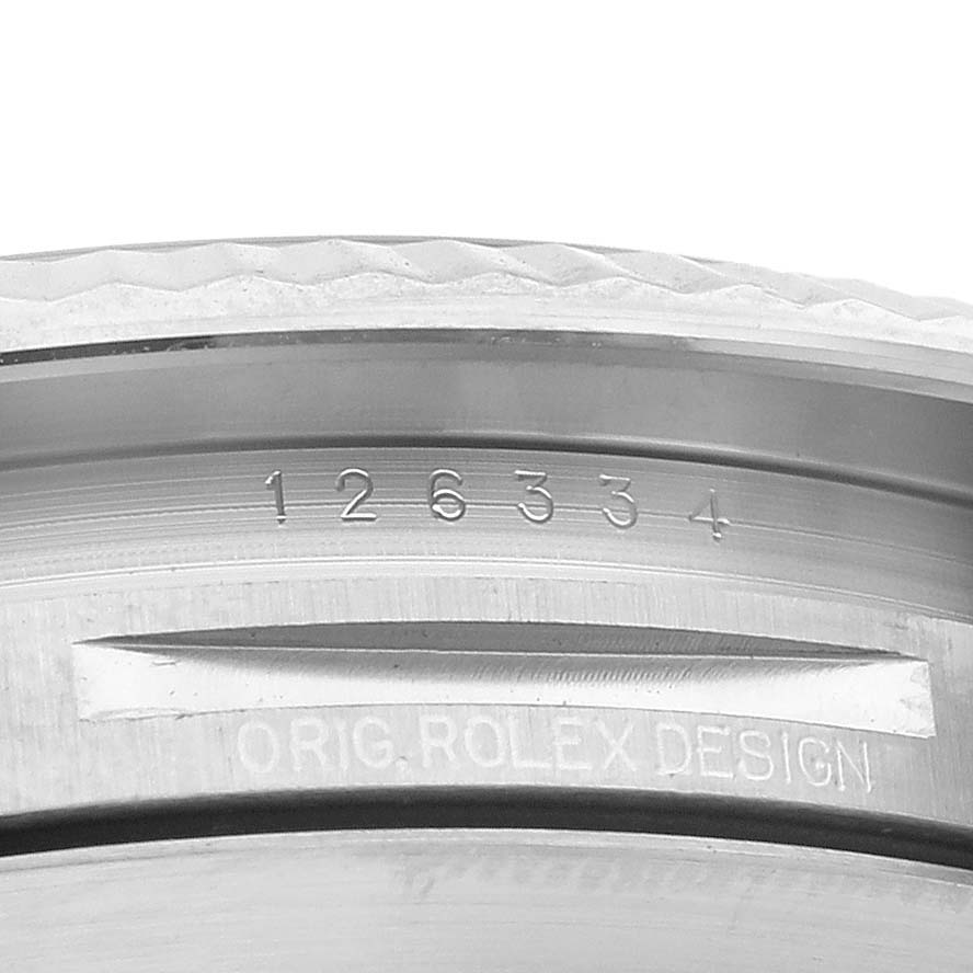 The image shows a close-up of the inner bezel engraving of a Rolex Datejust 41 126334 Men
s Stainless Steel Blue Dial 126334 Men
s Stainless Steel Blue Dial, highlighting the model number and "Orig. Rolex Design" text.